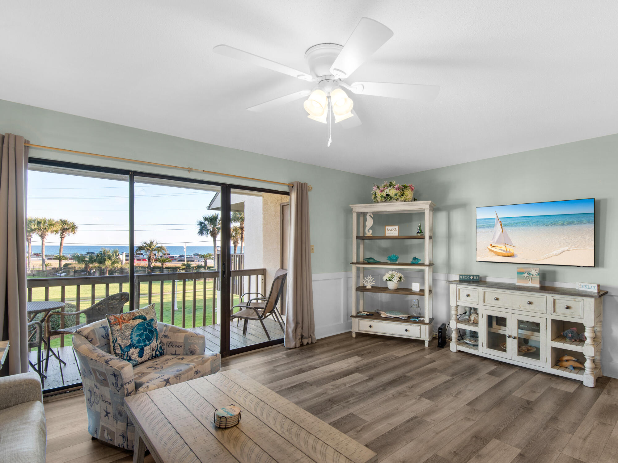 Gorgeous unobstructed views of the gulf and community amenities with plenty of outdoor seating to enjoy the beach life.  Owner meticulously upgraded this townhome with new LVP flooring, fresh paint, kitchen cabinets with  granite and fresh furnishings. Offered fully furnished and every inch of the condo itself is decorated with a tropical, beachy feel. Enter into the remodeled kitchen with large breakfast bar and dining with TV area. Private bedroom with doors onto your covered patio where you can walk to the pool or beach. Upstairs is the large living area with wet bar, huge deck, private bedroom #2 and 2nd full bath. Beach access steps away, lush tropical landscaping, private community pool and pet friendly for you and guests. Convenient front door parking with 2 dedicated spaces. Short term rental friendly and has a 4.7 rating with many repeat guests. With 5+ miles of walking and biking trail along Scenic Gulf Drive with endless views of the water and sand, this is the most sought after location in Miramar Beach. Enjoy beach front restaurants with entertainment you can walk to and it's also golf cart friendly up and down Scenic Gulf Drive. Close to Silver Sands Outlet Mall, Sandestin's Baytowne Wharf for a marina and outdoor amphitheatre, kids activities and grown up events throughout the year. A short drive to Destin's Harborwalk or the 30A lifestyle for upscale dining and shopping.