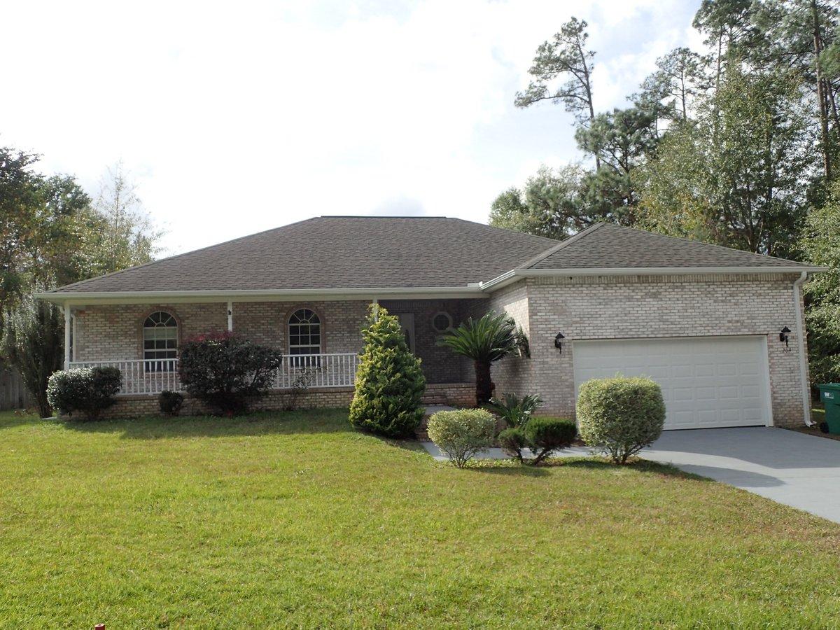 Welcome home! This beautiful all brick home is located in the heart of Crestview in County Club Estates and is minutes from the interstate, local shopping, and Duke Field. A 4 bedroom 2 bath split bedroom design home, this 1998 home has large open porch, three dimensional roof, screen back porch and a new garage door with opener. Vaulted ceilings in the living room, this spacious home has a brick fireplace, new flooring throughout, new paint, and more. Looking for move in ready? You've found it. As the availability of homes begins to dwindle, don't let this one pass you by. Call before this one is gone!
