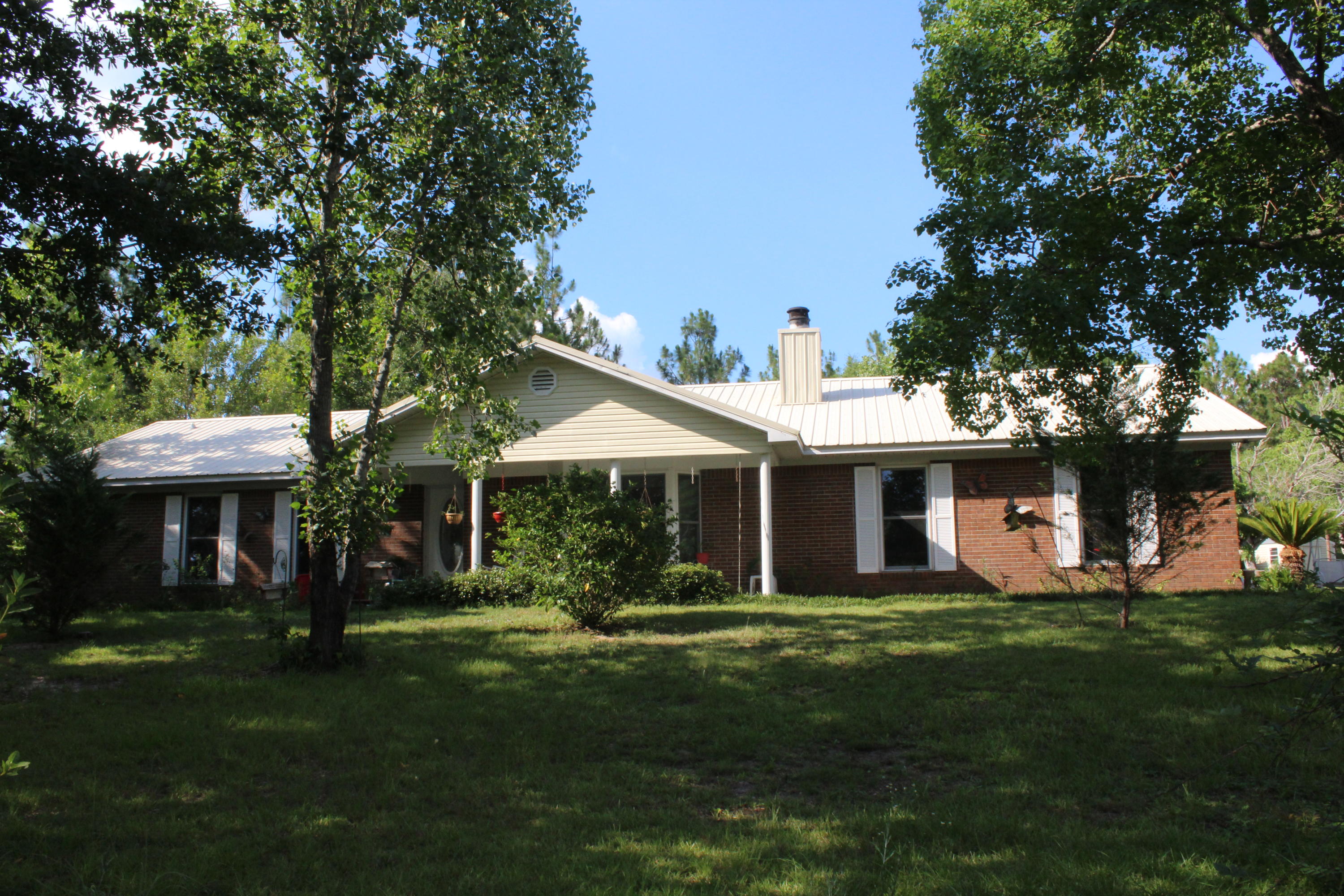 Short Sale: Over 12-17 Acres and a pond!! This home features 3 bedroom/3 baths and 1861 sq ft! Enter the foyer into an open floor plan. The living room opens to the kitchen. The living room features a bay window and a wood burning fireplace. The kitchen has breakfast bar that seats 3-4. Just off the kitchen is an extra large laundry room, Florida room and full bathroom! The master bedroom is large and features a nice master bathroom. There are an additional two bedrooms that over look the backyard. This home allows for much privacy! If you are looking for privacy and land, but still close to Crestview, shopping, dining, and schools, make an appointment to see this property! Buyer to verify all dimensions and information. Appliances do not convey.