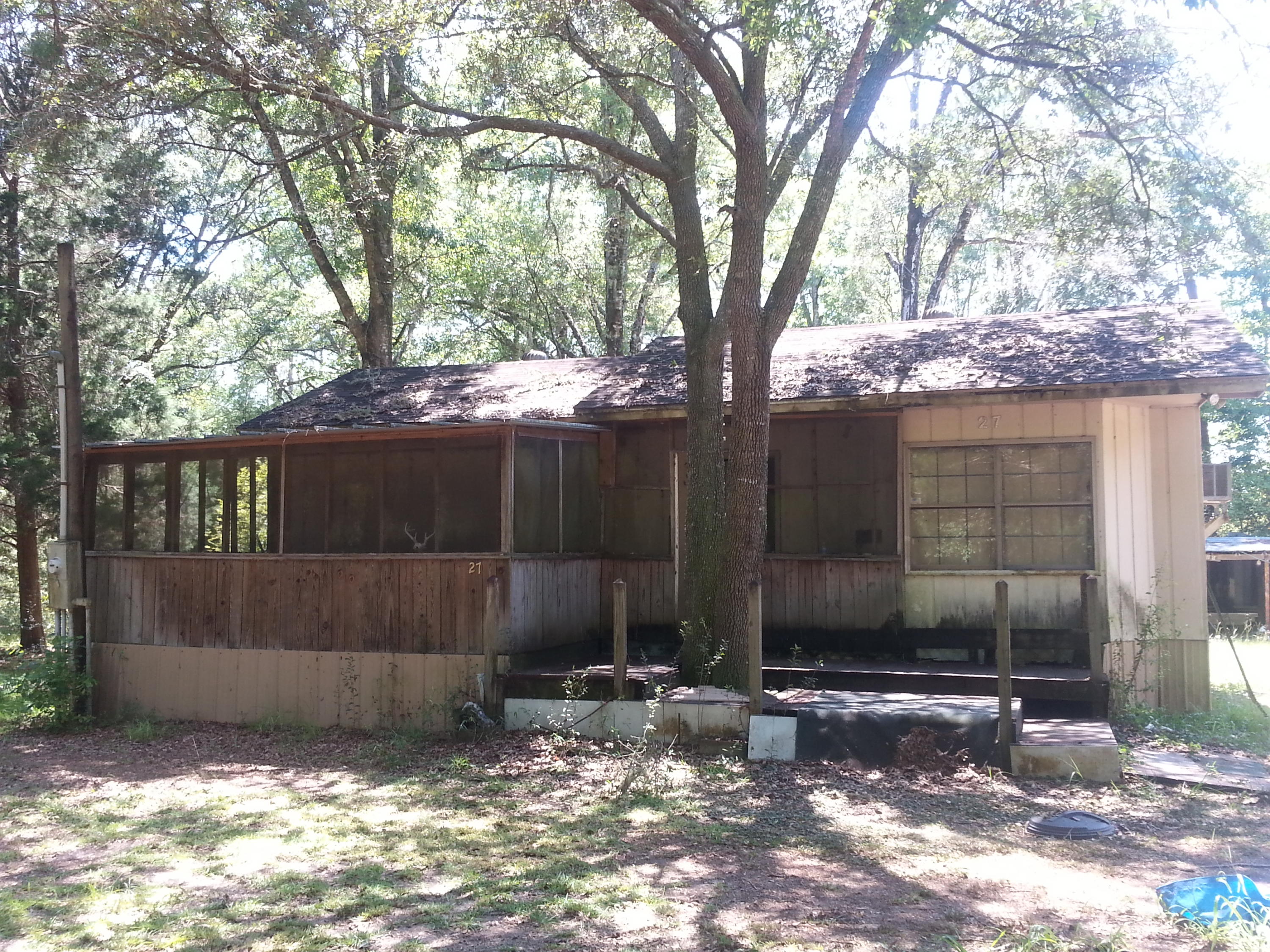 Beautifully wood parcel with large oak trees. There is an old cabin (1bed/1bath) on the property.  It's truly a fixer upper! There is an existing well with no pump, septic and power pole on the property all being sold ''AS IS''.  This property is unrestricted,  No HOA.
Flood Zone X and Walton Co GIS shows No Wetlands.

Property is approx. 15 mins from Freeport.  Also, centrally located between Destin and Panama City FL in close proximity to Morrison Springs, (2) boat ramps providing easy access to Choctawhatchee Bay via Black Creek and only 20 mins to Grayton State Park in Santa Rosa Beach.

Information contained within this listing is deemed to be accurate but is not guaranteed. Buyer to verify.