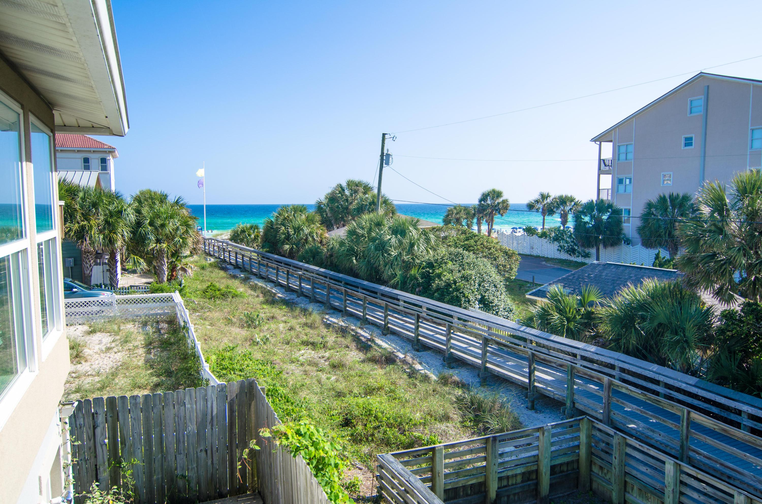 Amazing Gulf views and just steps to the beach - what a price for this location. And ZERO HOA fees! Would be an amazing short term rental machine! Water views from the upstairs which boasts a large wide open floor plan. Plenty of windows let in the natural light. Spacious floor plans has huge kitchen with island, large dining area, built in bar area and 2 extra large living rooms...perfect for the whole family can enjoy the beach. Two car garage offers plenty of storage for all your beach toys. Fenced in back yard opens up right by one of two beach accesses. Quiet neighborhood, close to Scenic 98 bike bath, Silver Sands outlets, plus all the great restaurants and entertainment! Classic beach charm. Buyer to verify all information.
