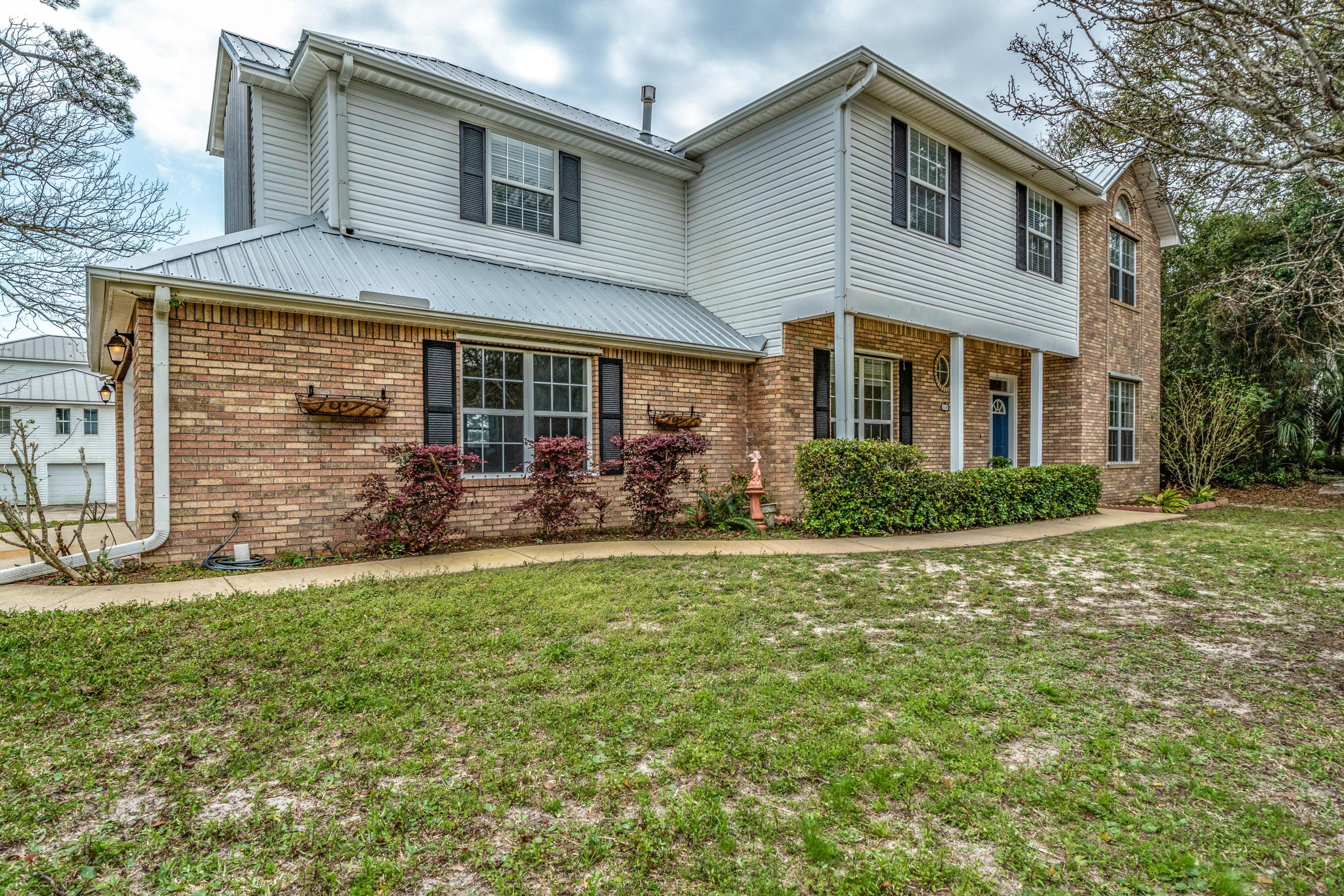Custom built 4 bedroom home with a waterview in downtown Fort Walton Beach. This charming home has neutral paint throughout, new front shutters, and a metal roof that was installed in 2017! The awning on the back patio makes this home great for entertaining friends and family and is the perfect spot for watching the summer fireworks. There is an easement at the rear of the lot leading to the private dock allowing boat access to the Bay and Gulf. The prime location of this home is sure to make this a quick sale!