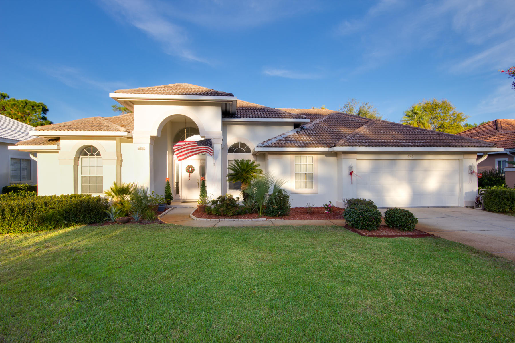 Lakefront home in the exclusive gated golf community of Emerald Bay! Expansive screened patio that overlooks the lake. Split bedroom floor plan. Master bedroom has sliding glass doors to screened porch, while master bath has a whirlpool tub, separate toilet area & walk-in closets. Kitchen is beautifully laid out with plenty of cabinet, counter space, tile flooring, pantry & all appliances convey. Two additional bedrooms are spacious with large closets. New flooring, new carpet & recessed lighting throughout. Beautifully landscaped with lawn pump & sprinkler system. Survey available (see documents).