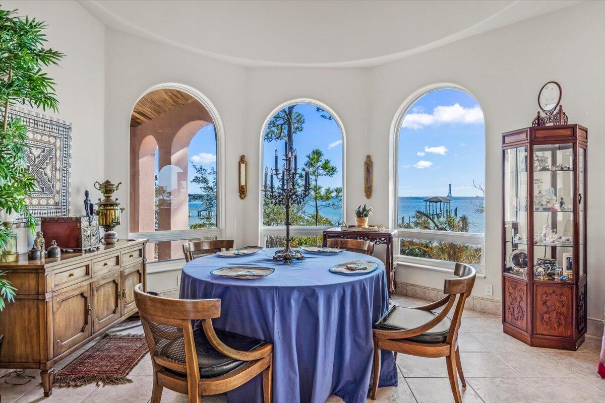 PRICE IMPROVEMENT on waterfront estate! This custom Mediterranean-style home with durable ICF construction, offers unparalleled elegance and breathtaking views of the Santa Rosa Sound. Step inside to discover exquisite details at every turn. The home exudes elegance, featuring dramatic floor-to-ceiling columns, handcrafted doors and a spectacular Mahogany staircase that leads to 2 beautifully appointed rooms. Master suite is a haven of comfort & sophistication, with a cozy sitting area and pass-through gas fireplace that adds warmth & charm. Geothermal HVAC. Experience the serene beauty of 295' of private waterfront from your covered patio, complete with elegant cypress wood ceilings, offering the perfect place to relax and take in the breathtaking views. Schedule a private showing today!