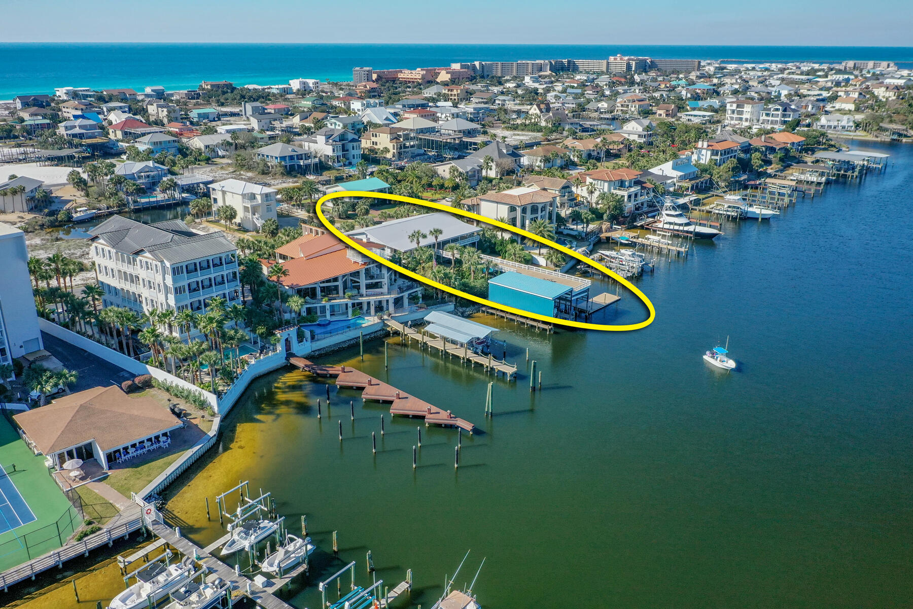 PRICE JUST REDUCED!!  Rare 110' of Deep-Water on the Scenic Harbor of Destin, Florida! This incredible property enjoys a quiet, private place on Destin's beloved harbor. It features a fabulous boat house and dock, huge sun deck, abundant outdoor covered decks, a gorgeous pool, and plenty of room for entertaining family and friends! The harbor offers deep-water for fishing and yachting enthusiasts, as well as all types of watersports, plus the property is just a short walk or bike/golf cart ride from the area's stunning white beaches, and a short drive to the Emerald Coast's best dining, entertainment, shopping and more!