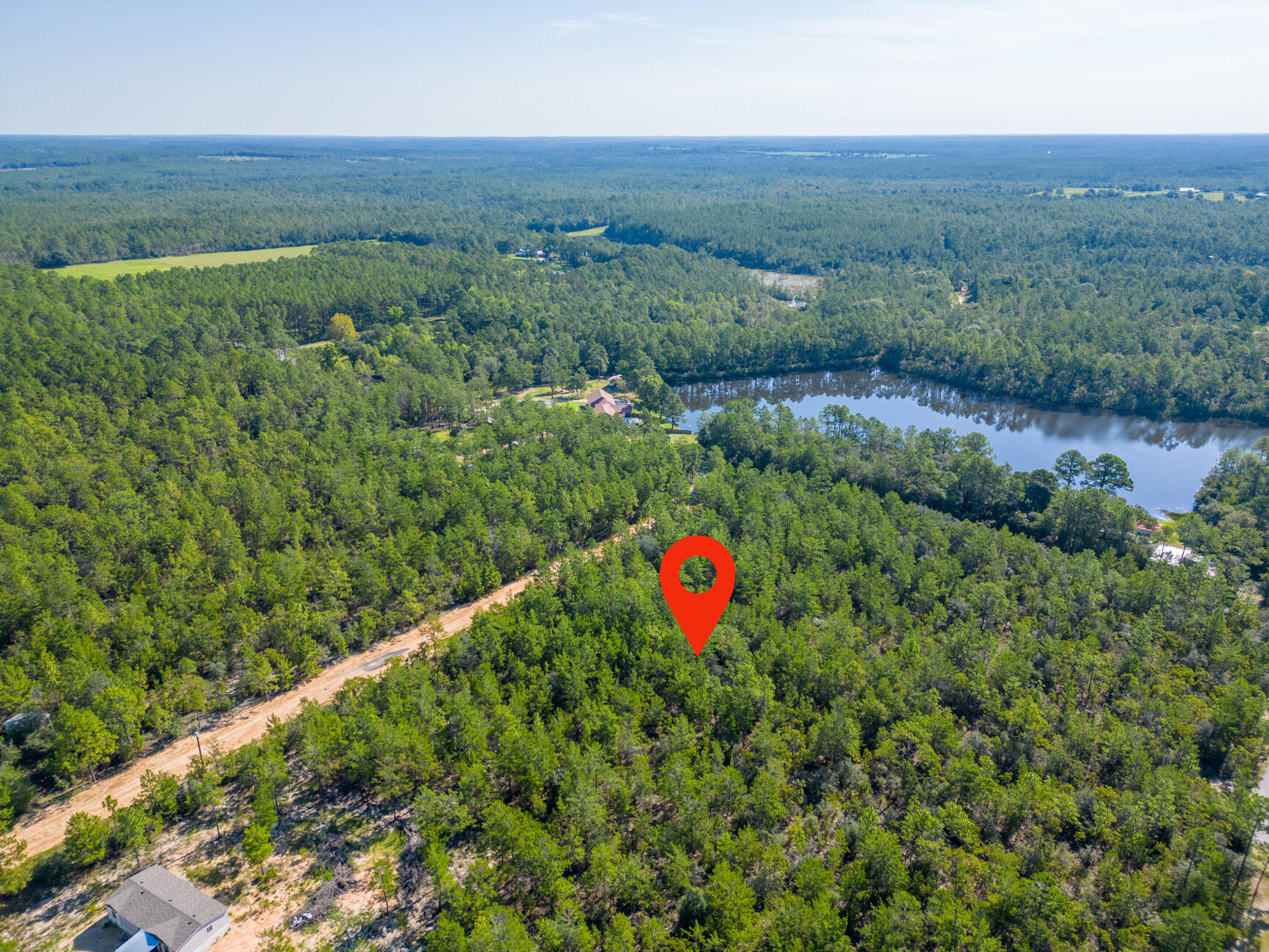 0.45 of an Acre Vacant Lot  High and Dry, Non-Flood Zone. GREAT LOCATION! Mobile homes are allowed with No HOA Fees! 

This spacious lot offers convenient access to major highways (HWY 90, I-10, 285, and 331). HWY 90 is just under 2 miles away, and the DG Market Store is less than 4 miles away. Located approximately 12 miles from essential amenities like hardware and grocery stores, schools, downtown, and the historic Lake DeFuniak, this lot offers both convenience and tranquility. Nature enthusiasts will be thrilled to discover the abundance of outdoor activities nearby, including fishing, golfing, national parks, and the stunning beaches of the Emerald Coast. (Close by popular cities: Niceville, Crestview, Fort Walton Beach, Destin Florida, 30A / Seaside, and Panama City Beach)

While no utilities are currently installed on the lot, electricity is available in the street; Water can be accessed through a private well, or a public connection with Mossy Headwater, for sewer service, a septic system would need to be installed. County-maintained gravel road.

This parcel contains 8 small lots, and according to the plat, with the plat indicating the possibility of future additional access through Lime Street if the road is opened.

Claim your piece of Florida land!

Adjacent lots Parcel A and B and lot E are also available for sale.