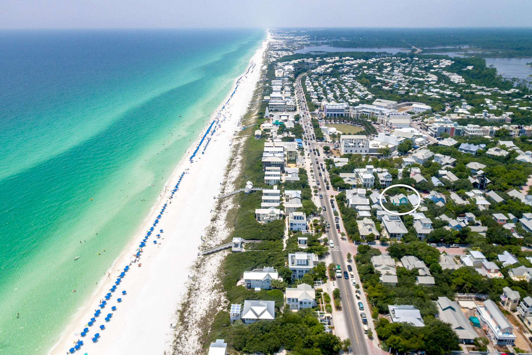 Located just 3 lots in from 30A across from the sugary white sand, Salty Dog has a laid-back, beach lifestyle. The cottage blends cheerful colors with relaxed accommodations. The front porch wraps around the south side of the cottage with plenty of room for outside dining. The open plan of the first floor allows for plenty of space to unwind at the end of a fun-filled day on the beach. Entertain guests on the porch or move inside to admire the crisp and modern interior. A recent update to the kitchen features quartz counter tops and stainless steel appliances. From the contemporary style, breakfast bar for casual dining, to the accompanying main dining space and comfy living room, there's much to enjoy about Salty Dog. The first floor includes a king bedroom and a second bedroom with two sets of built in bunk beds. The bedrooms share an updated bath with double sinks, quartz vanity, subway tile shower and allow for private access to the relaxing front porch. Another king-sized bedroom and updated bath offer additional room on the second level. The unexpected surprise of a third floor tower room allows for additional living space with built-in bench seating for entertaining and gulf views. From the scenery at the top level to the charming covered porch, the whimsical Salty Dog cottage presents an ideal beach side setting. Add all of this to a location that's just a short stroll to some of the best shopping and dining in Seaside's Town Center! Room to enlarge main cottage and add separate guest cottage. Furnished less art and porch furniture.