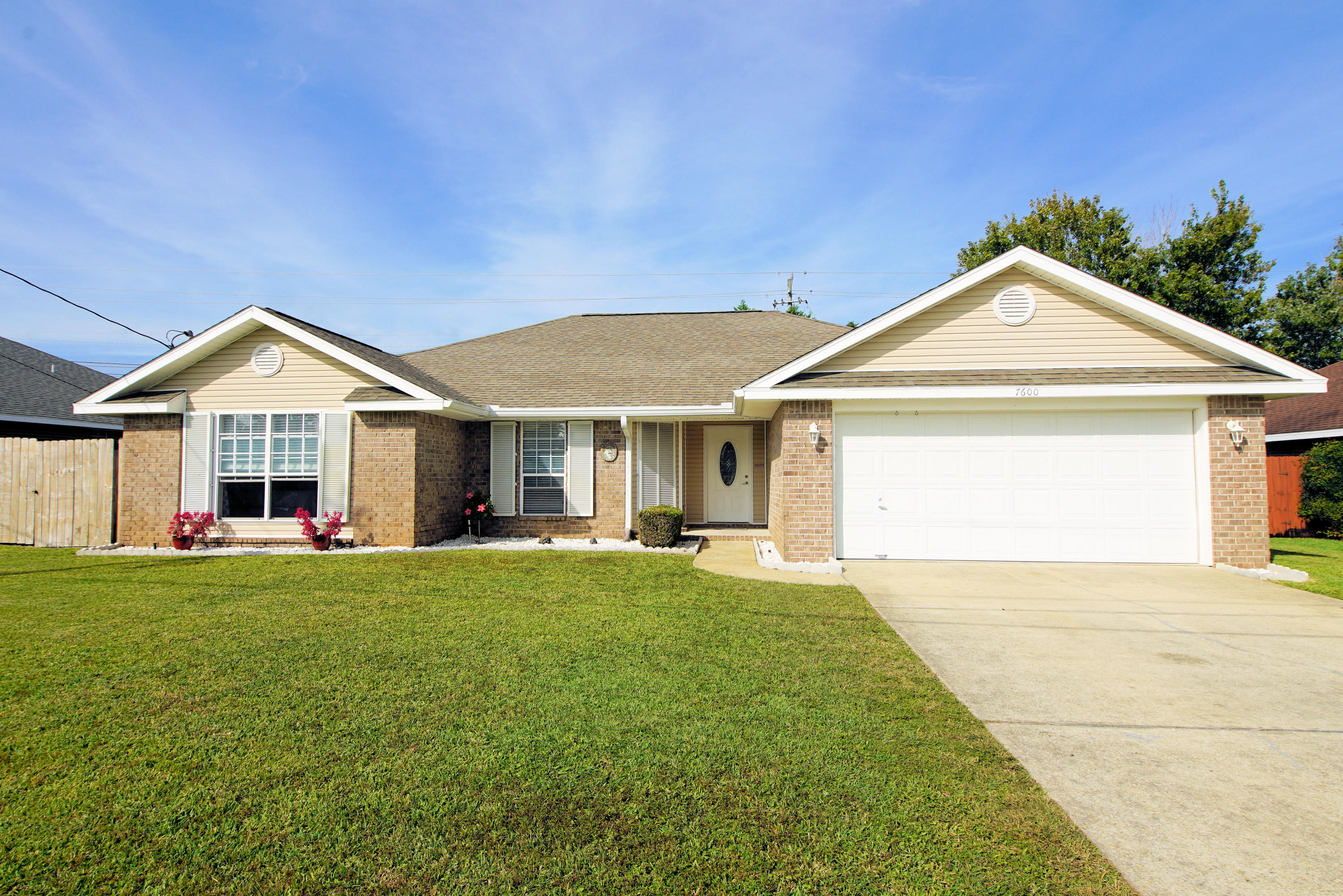 Gorgeous brick home with 3 bedrooms and 2 baths and 2019 Sq ft located in Martha's Cove Subdivision in Navarre FL! This home is located minutes to the white sandy beaches, shopping, restaurants and great schools! Roof is a 30 year architectural shingle year 2012, HVAC replaced in 2012, hot water heater is year 2007, Hurricane Shutters are present to lower insurance cost, gutters are on front and back of home, all windows are double panes, and a termite bond is on the home that is transferable! Enter the home through the steel front door and notice the open floor plan! The large living room opens to the kitchen and dining room! The living room has vaulted ceilings with a ceiling fan! The living room also has large picturesque windows overlooking the fenced backyard and open patio! The kitchen is large with a center island and a large pantry! The master bedroom (16'x15') has a walk-in closet and large master bathroom! The master bathroom has a double vanity and tub / shower combination. There are another two guest bedrooms and a full guest bathroom. The laundry room is spacious and has room for extra storage! There is a two car garage with attic pull down stairs and extra attic decking with a huge area for attic storage! Buyer to verify all dimensions and information!