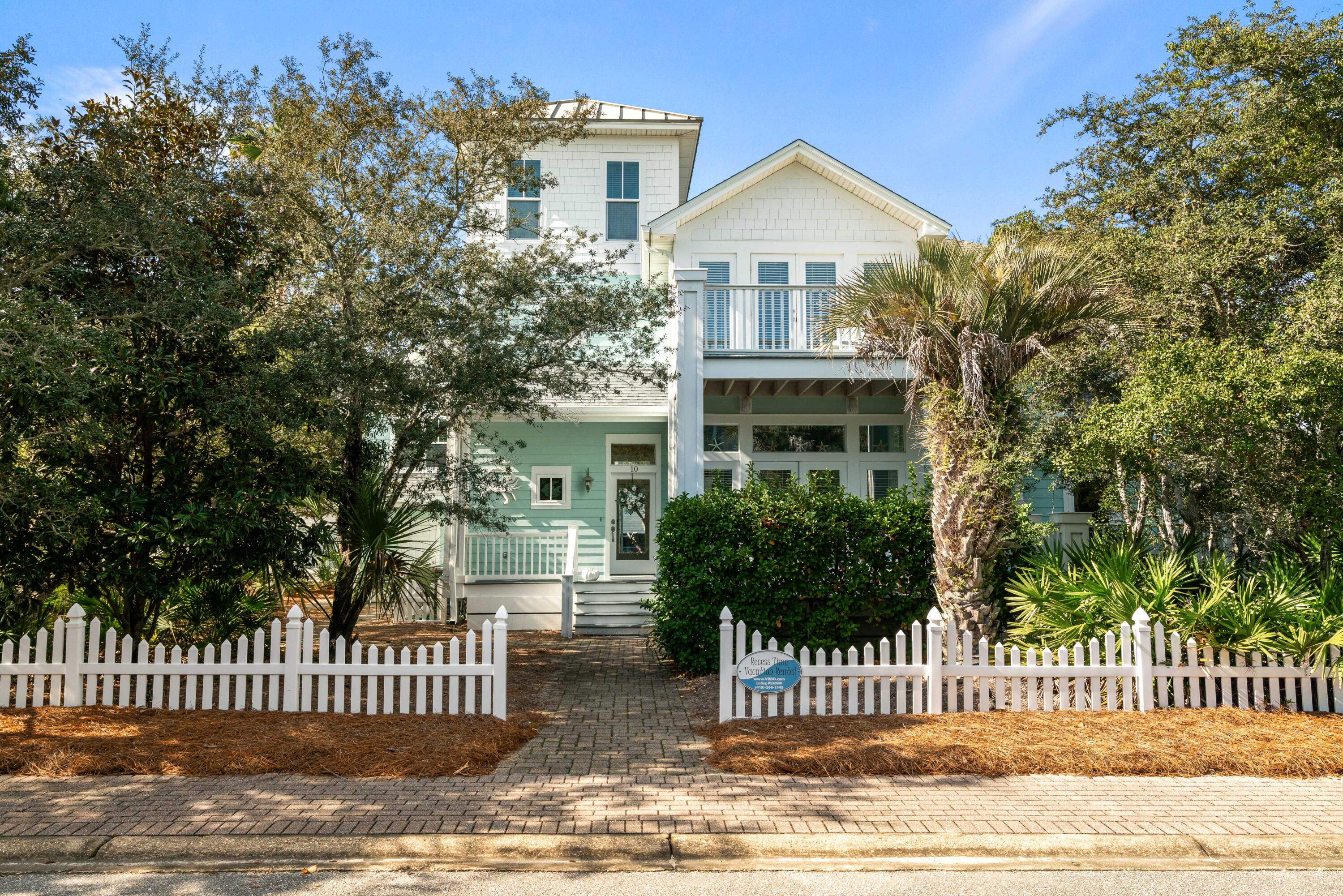 This beautifully designed 3-bedroom, 4.5-bath home offers 2,350 square feet of living space and is located in a small, private gated community just steps from the Gulf. From the front door, it's an easy one-minute walk to the community's private beach walkover, leading to one of the widest and most pristine beaches along Scenic Highway 30A.  The first floor features an open, connected living, dining, and kitchen area with a dramatic 20-foot soaring ceiling, creating a bright and inviting space for gathering. Just outside, a 32-foot covered porch runs the length of the living and dining areas, perfect for indoor-outdoor living, meals, and relaxing after a day at the beach. A wide hallway connects the front and back entrances and includes a full bathroom and laundry room for adde convenience.
The updated kitchen is ideal for entertaining and extended stays, boasting two full-size refrigerators, a bar sink, a double sink, and generous cabinet and pantry space. Also on the first floor is a private ensuite bedroom, which opens through French doors to its own cozy porchan ideal spot for morning coffee or evening downtime.
Upstairs, the second floor offers two additional ensuite bedrooms. The king bedroom features French doors opening to a private balcony, while the third bedroom includes two queen beds with its own bathroom. Built-in twin bunk beds are tucked into the hallway, with a conveniently located half bath nearbyperfect for kids or extra guests. This level also includes a dedicated workspace with a spacious desk and built-in bookshelves, ideal for remote work or quiet study time.
The third floor completes the home with a versatile bonus retreat, often used as a TV lounge, exercise room, or additional sleeping spaceperfect for flexible living and extra guests.
The 62-home community itself is a standout feature, offering a large community pool that is heated in the spring and fall, surrounded by ample chaise lounges and shaded tables under a canopy for meals, snacks, or working poolside. Many residents and guests enjoy setting up a remote office in this relaxed, resort-style environment.
In addition to the private beach access, the community also features a dock on Draper Lake, complete with seatingideal for fishing, launching a kayak, or simply enjoying the peaceful water views.
A rare combination of space, location, and amenities, this home delivers the best of 30A coastal livingsteps from the beach, thoughtfully designed for comfort, and set within a community that truly feels special.
