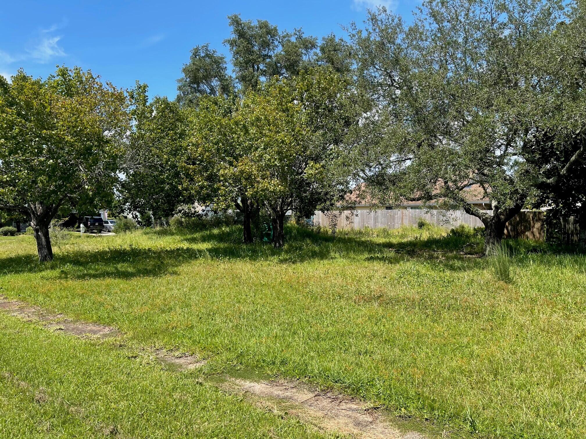 Looking for an incredible location to build your dream home? Check out this buildable lot in an established neighborhood just 4 miles west of Hurlburt Field with the protection of a traffic signal at Parish Blvd for safe access.  This level lot is nearly 1/3 of an acre, on a curve in the street, so it feels like a corner lot, located in Parish Pines.  A side-entry garage floorplan would be ideal for this lot, with plenty of room for extra parking.  There is no Home Owners Association in this subdivision. The lot has power and water accessible and is ready for you to build the home of your choice. Located about 10 miles from the sugar-white sandy beaches of Navarre or travel east about 10 miles to Okaloosa Island beaches. Conveniently located near shopping, schools and military bases.