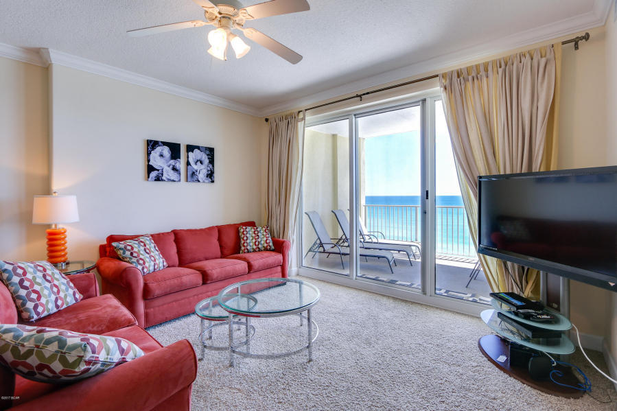 Looking for a value priced, low floor unit on the west end with great rental history? If so, you must see see this breathtaking 2 bedroom, 2 bath waterfront condo located on the 9th floor of the Ocean Reef Condominium Complex! Ocean Reef 906 boasts a GULF FRONT master bedroom & living area (split floor plan), comes with an ASSIGNED COVERED PARKING SPOT, is professionally furnished, has a HUGE balcony (one of the largest you'll find in Panama City Beach), and conveys with a great rental history. The kitchen features wood cabinets, granite countertops, & tiled breakfast bar with a beautiful mosaic design. You will love the huge laundry area that can be used for storage or a pantry. The owners have kept this unit in great shape and you can tell. It is located in a PRIME LOCATION