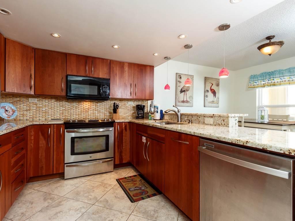 This completely recently renovated 2 bedroom, 2 bath Gulf front condo is located on the most desirable floor (4th)within the complex. From that floor you have a complete view of the beach and Gulf. Best of all it is completely furnished and ready to immediately move in and enjoy because all of the work has been done. All NEW cabinets, granite, stainless steel appliances, kitchen sink/faucet, tile (all rooms), doors, windows, sliding glass door, HVAC, water heater, washer/dryer, furniture, fresh paint, pictures, ceiling fans, TV/DVD players (all rooms), both baths with beautiful vessel sinks w/waterfall faucets & master bath walk in shower.Large balcony w/hurricane shutters offers dramatic views of the 80 foot pool but is uniquely private & away from the noise. OVER $34K Rental INCOME/YR. Spacious, open floor plan provides view of the emerald waters and white sand from the living room, dining area and kitchen.  Floors are tiled thru out and you will love the open spacious feel.  The unit is equipped with high speed internet and phones in all rooms.  Definitely a must see if you are in the market for a condo!