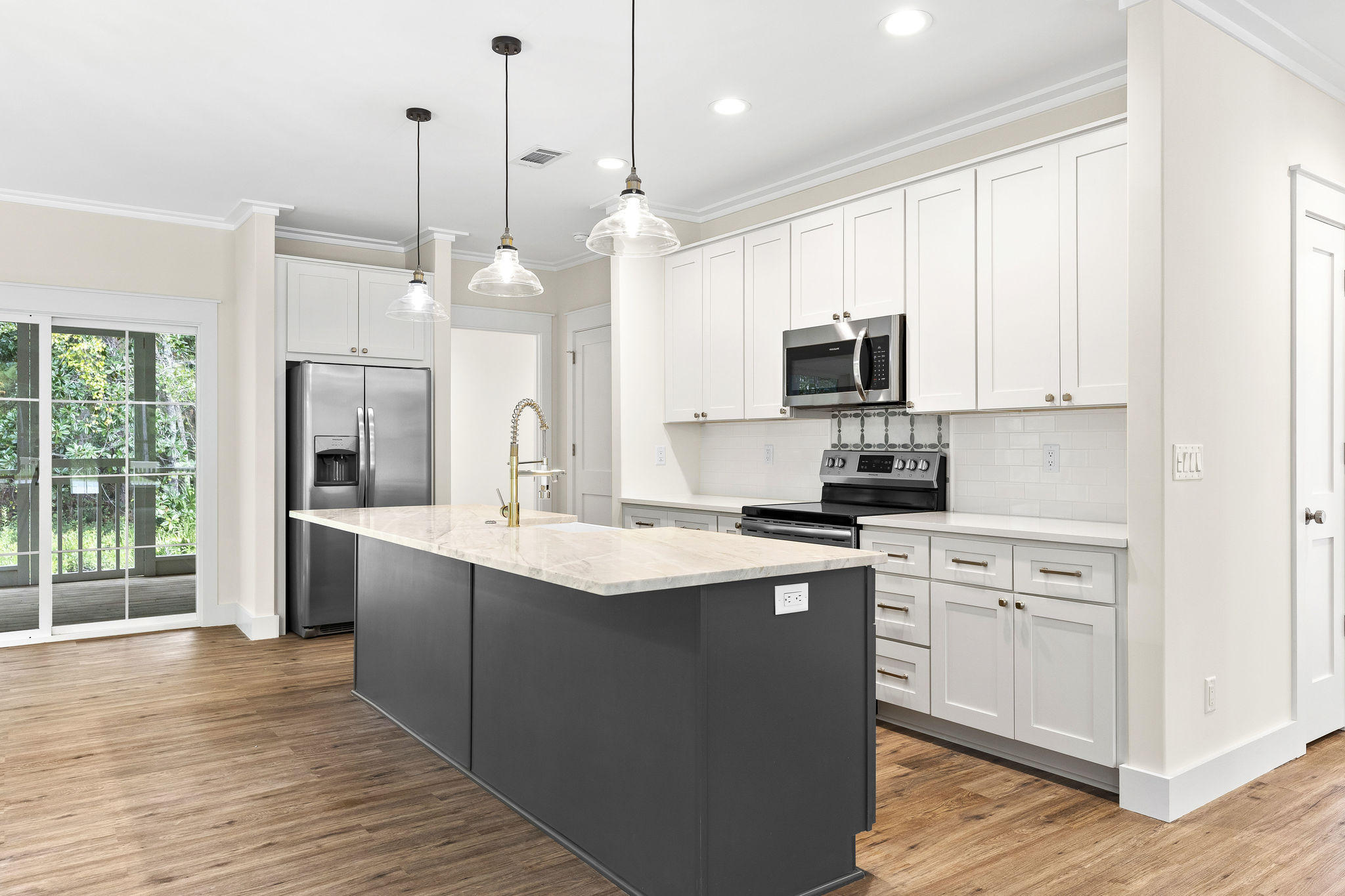 Move-in ready, new construction cottage located in the Magnolia Beach neighborhood of Pt. Washington. 107 E. Georgie is just a short stroll away from the Choctawhachee Bay and minutes away from biking/hiking trails, Scenic Highway 30A and the alluring beaches and attractions of South Walton. The home sits on an oversized lot featuring 3 bedrooms, and 2 full baths. The 1653 square foot cottage consists of an open floor plan with abundant natural light and modern finishes throughout. The kitchen features full overlay cabinetry, large kitchen island, farmhouse sink, stainless steel appliances, and custom subway tile backsplash. Notable highlights include dual vanities in Master Bathroom, custom Spanish tile flooring, floor to ceiling tile in the bathrooms, and large screened-in back porch.