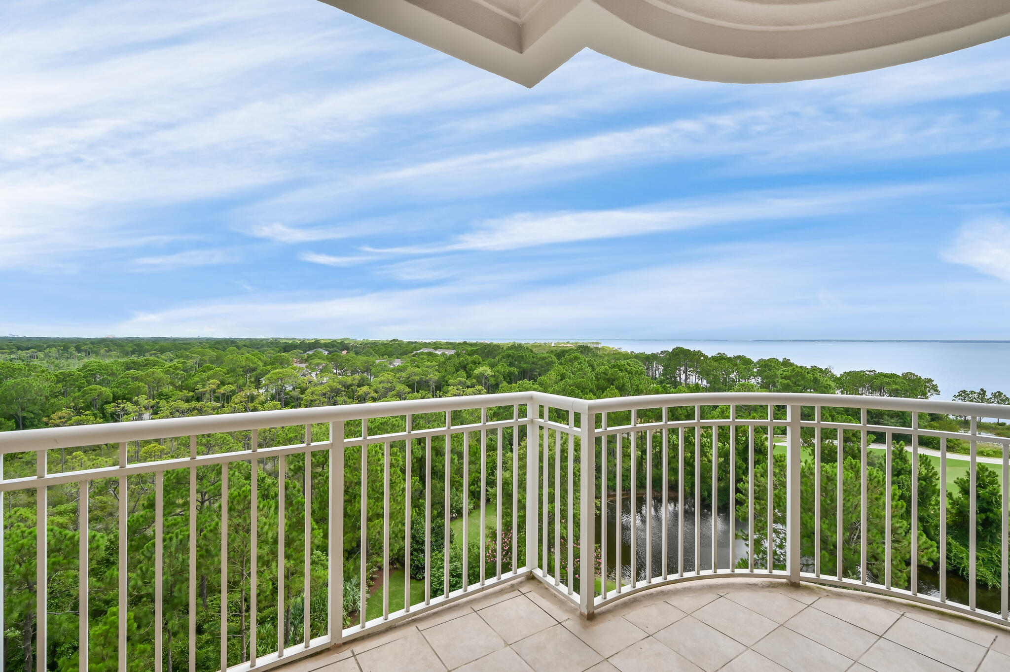 One of the most desirable locations in One Water Place with Western Views that are unobstructed and on the 7th floor. The residences of One Water Place at Kelly Plantation simply redefines condominium living. Enjoy beautiful views from this luxury condo overlooking the bay, lake and Kelly Plantation golf course. Freshly painted with new lighting, this beautiful unit presents like new! Located on the 7th floor, with the largest floor plan available in One Water Place (The Darlington) featuring 3 bedrooms plus an office/ media room. The spacious living area with double sided gas fireplace accesses two balconies, one complete with an outdoor kitchen & built in gas grill. The chef quality kitchen has stainless steel Viking appliances with solid wood cabinets, granite counter tops, and travertine floors. The formal dining room offers a pass through from the kitchen as well as a private pantry. The split floorplan offers the most privacy for the main suite along with premier views.
