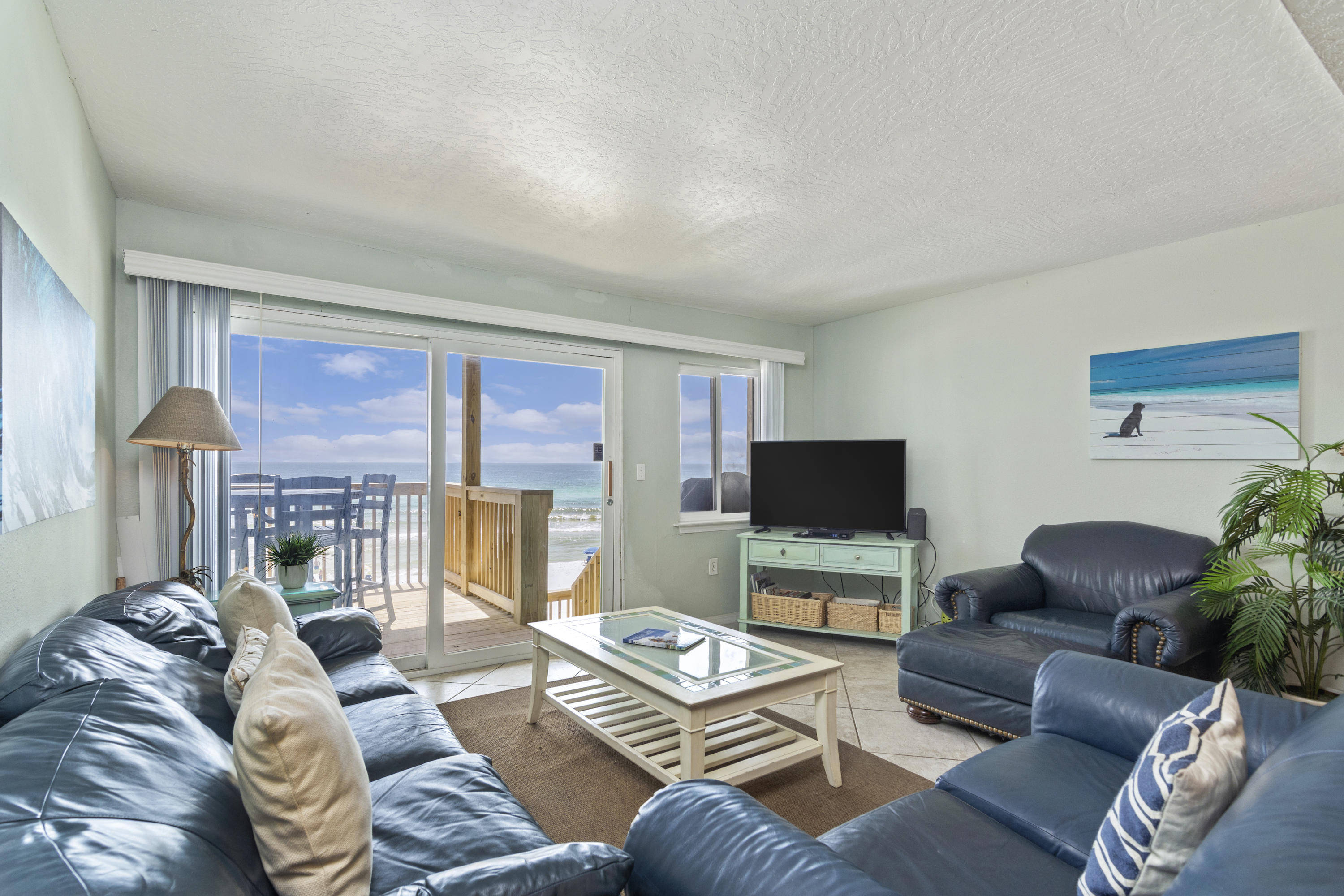 Wow! This 4 bedroom, 3.5 bathroom GULF FRONT townhome located on Scenic Highway 98 in Miramar Beach is a must see. An open floor plan creates a relaxed flow, while numerous large windows and doors provide an abundance of natural light throughout this residence. On the first level are two bedrooms and a bathroom. On the second level is a spacious living and dining area, along with an open kitchen. On the third level is a master suite with its own bathroom, and a third guest bedroom with its own bathroom.  Each level has its own NEW DECK with stairs leading to the beach.  Below the residence is a sizable storage area.