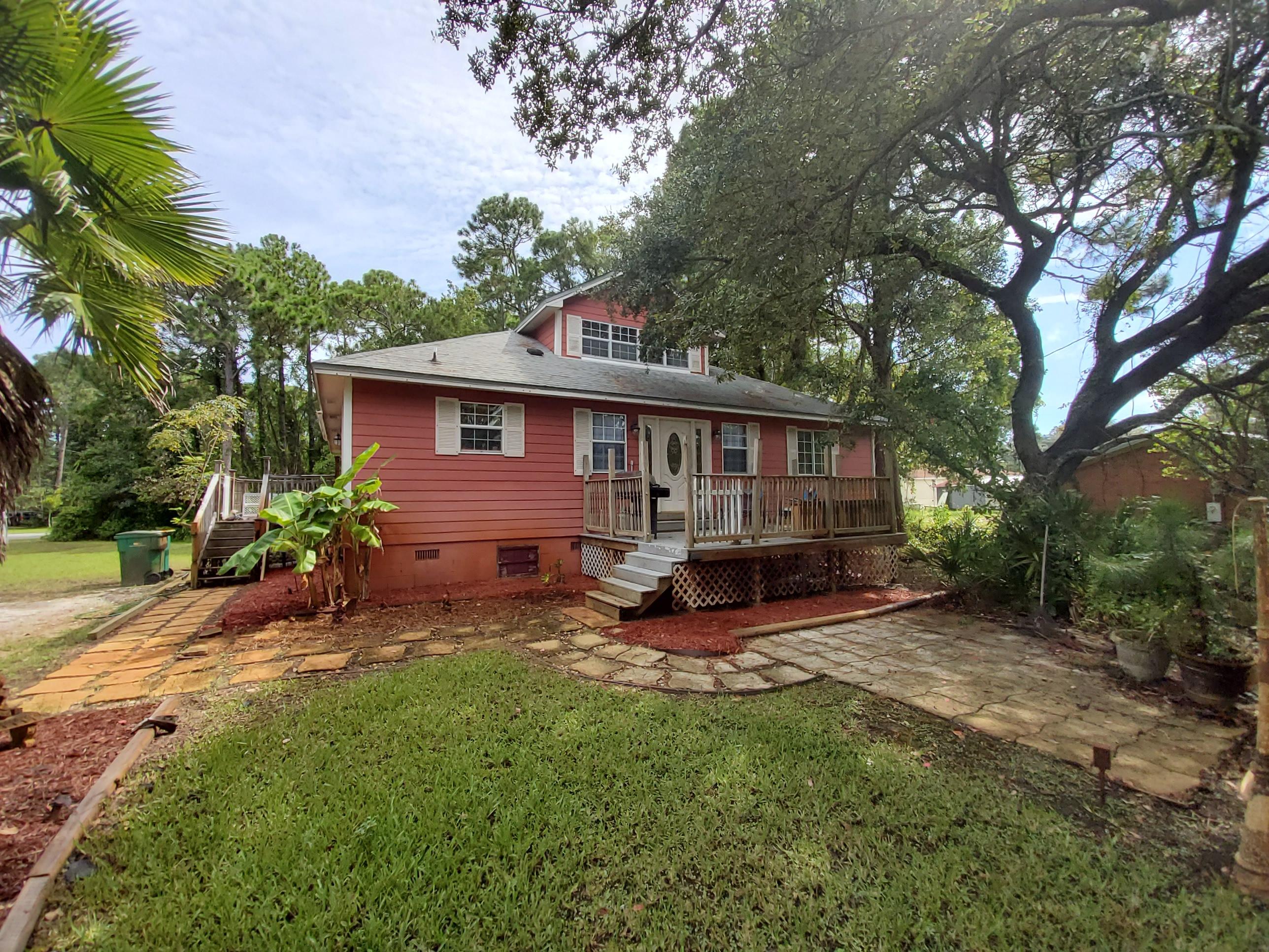 West Destin Home  just minutes from Joe's Bayou boat launch leading to the Bay and the Gulf. Enter the home from either the front porch or side porch.  Two living areas on First Floor and abundance of natural light in bright open rooms.   Wood-look Driftwood Tile adds a Beachy Ambiance.  Access a Sun Room from informal living area or one of the bedrooms. Relax on the back deck.  Home has an exterior outlet for a generator.  Upstairs bonus room features a pool table that conveys! Possibly a 4th bedroom and dedicated stairs. Plenty of storage plus a bar in the 2nd level recreation room.  Kitchen has  updated wood cabinets and oven mounted over a cook top can work as a convection oven or microwave oven.  Stainless refrigerator new March 2020. Three bedrooms located on 1st floor.