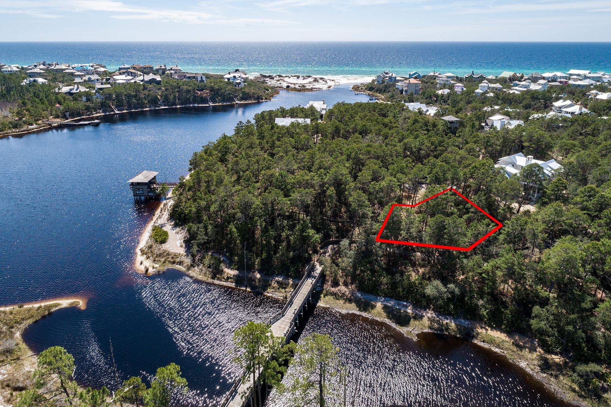 Situated on the Southside of Scenic Hwy 30A in the western peninsula of Draper Lake Coastal Village. Conveniently located near the pathway leading to the beach, community pool, dock, park, observation tower where views of the beautiful Gulf of Mexico can be seen and the bridge that leads to the eastern peninsula amenities. Additionally, owners may conveniently keep their paddle boards/kayaks at one of two boat houses on Draper Lake. Just over a quarter mile down a neighborhood street is a private facility with golf cart parking for quick beach access and is reserved exclusively for Draper Lake owners. Due to its central location, this lot is perfect for a home to enjoy the quiet serenity of Draper Lake while being only a short stroll from the beautiful beaches of South Walton.