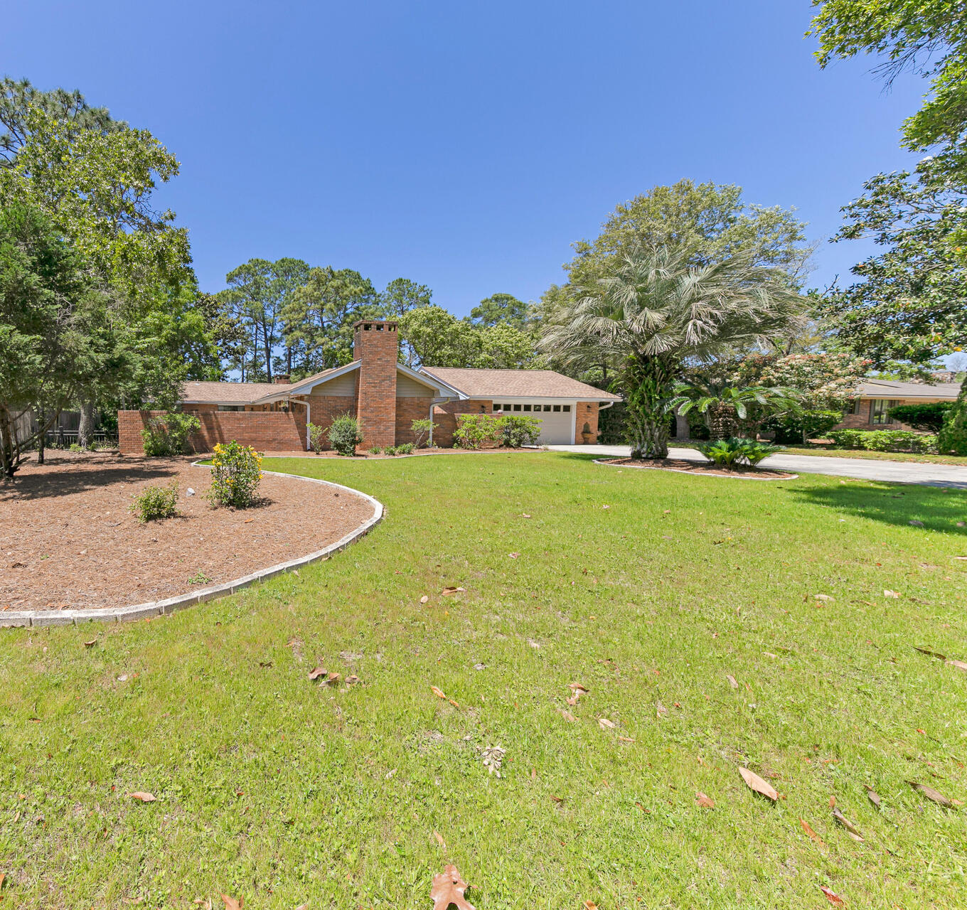 PRICE IMPROVEMENT AND READY FOR AN OFFER on this Beautiful 4-bedroom waterfront home on Grass Lake Bayou which opens up to Choctawhatchee Bay and beyond. Enjoy beautiful sunsets and fish off your own dock. Boat to Crab Island, Destin Harbor, local fishing spots and waterfront restaurants within minutes. A private gated courtyard takes you to the front entrance. This waterfront home features 2 living areas, 2 fireplaces. Master bedroom & 2 of the guest rooms overlook the water. There is another courtyard off one of the living areas. Extra wide driveway for RV parking. An additional sunroom overlooks the water as well. New A/C system 2023, water hearter 2024 roof 2021, dishwasher 2023 and newly painted. New sod & irrigation in backyard 2023. Raintree Estate owners enjoy larger private lots  and a low non-mandatory HOA of $150 annually to enjoy two neighborhood parks for social gatherings. The bay/bayou park with beautiful sunset vistas has a pavilion, BBQ firepits, along with a dock for fishing and kayak launch. The centrally located woods park offers a ballpark and trails to explore. Easy access to Mid-Bay Bridge, military bases, local groceries, restaurants, shops and entertainment.