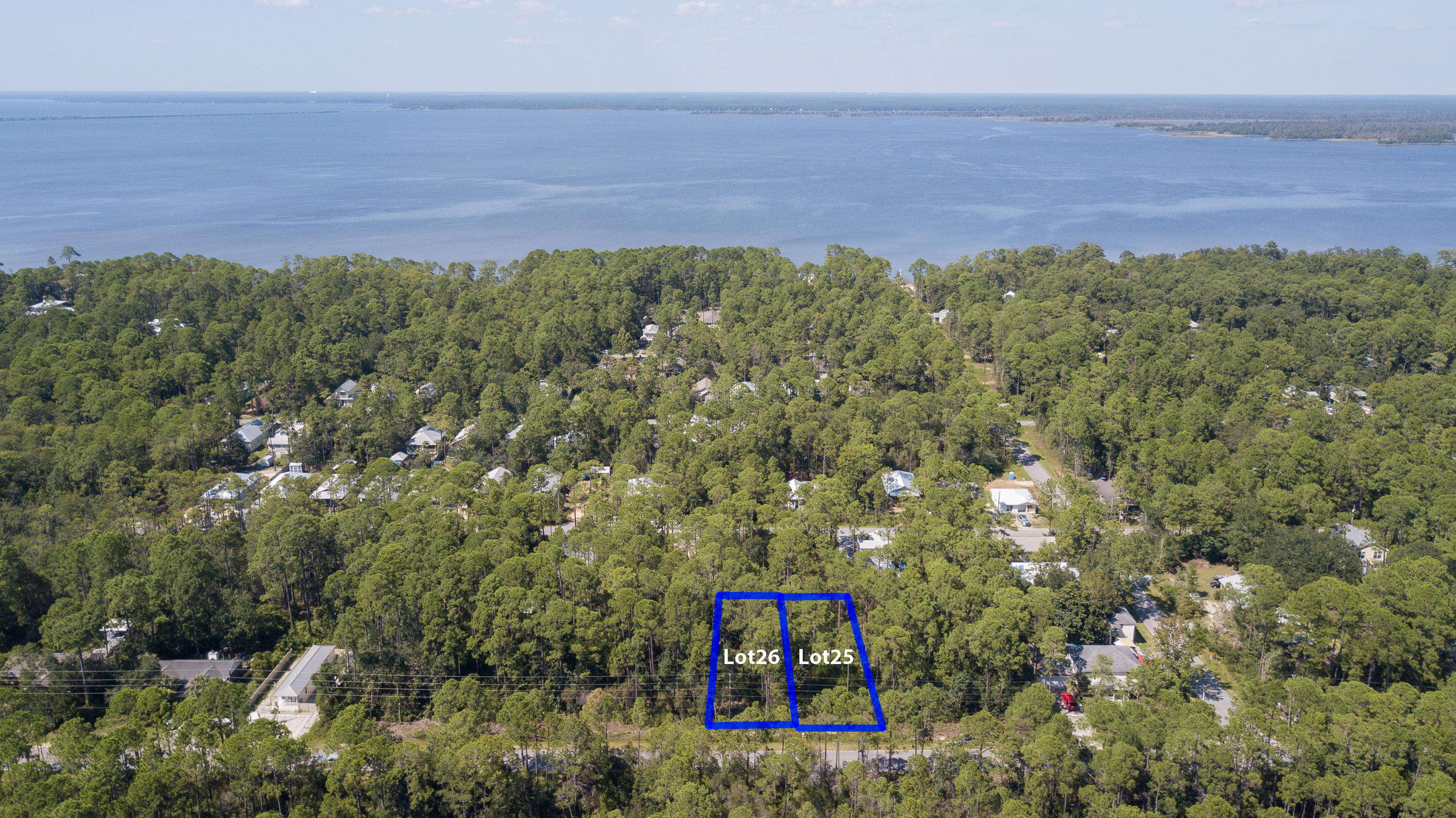 MOTIVATED SELLERS! Two beautiful lots adjacent to each other in Point Washington, with all studies completed, tap fees paid and ready for you to build your dream home! Located in a very quiet area, only a few blocks from the bay and in Flood Zone X. The property was recently forestry mulched, leaving several beautiful magnolia and pine trees. Each lot is approximately .17 acres and measures 50' x 150'. Don't miss this opportunity!