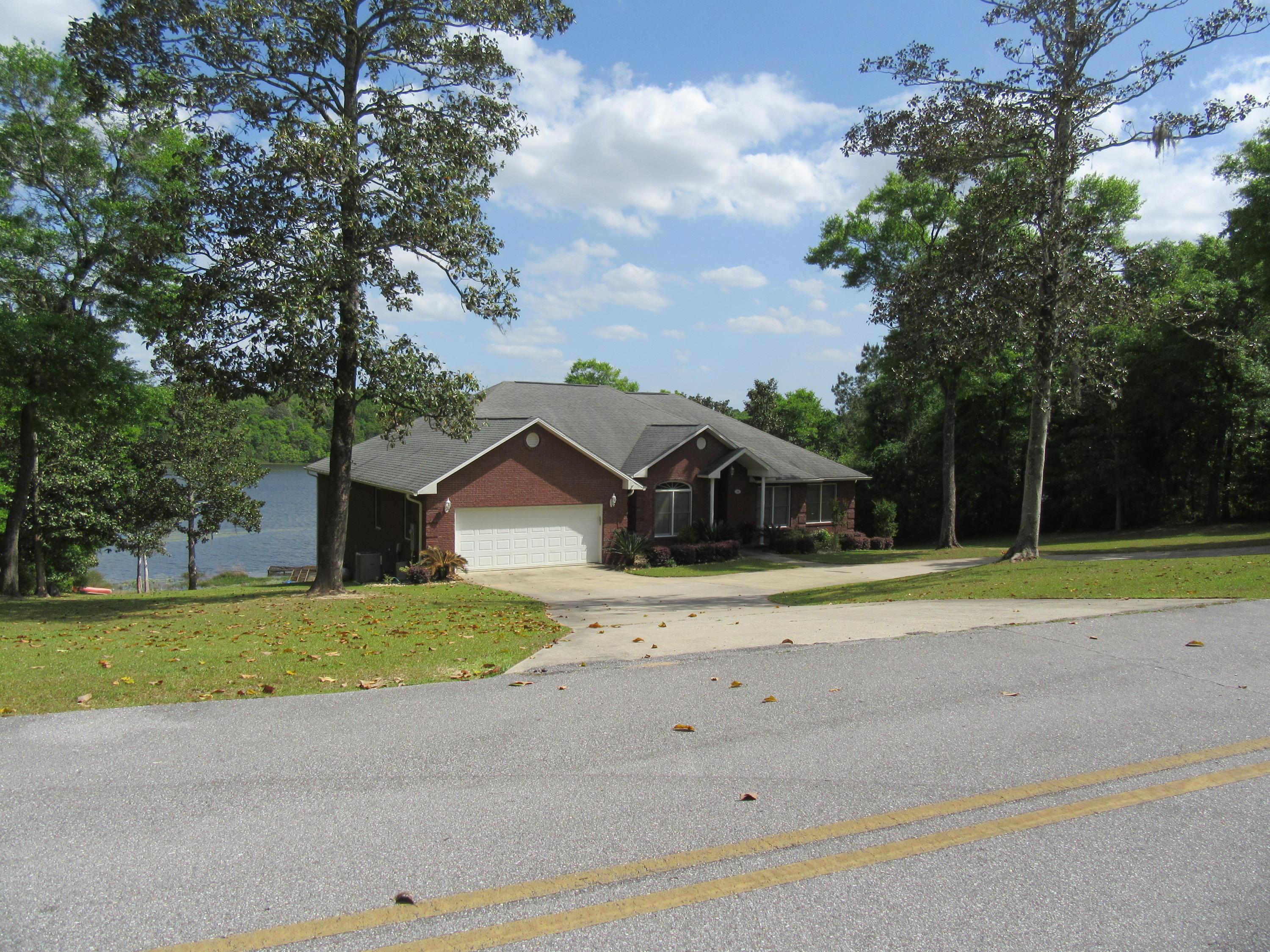 CUSTOM BUILT LAKEFRONT HOME ON A FULL ACRE! This home offers a gorgeous panoramic view of Lake Holley. The foyer leads you in to a spacious open living room. The kitchen boast granite countertops along with immaculate custom cabinets. Enter an expansive deck from the living area or master bdrm that overlook the pool and lake. The lower level of the home consist of an astonishing recreation room,& separate exercise room with a full bath with a walk in shower. NEW DOCK