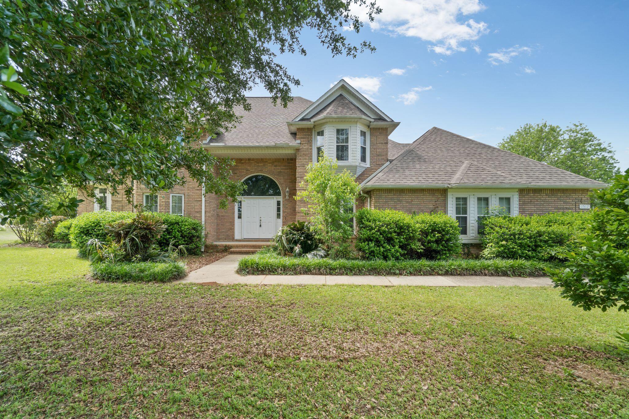 Beautiful two story home located in Sky Park Estates with your own private grassed runway strip in the backyard. This home sits on 1 acre offering space both inside and out. Stepping in you will be greeted by the a grand foyer with beautiful oak staircase. Off of the entrance sits an office space, it could easily double as a guest room so they have their own private space. The kitchen boasts a formal dining room, breakfast nook, pantry, and loads of cabinets. Continuing the downstairs tour you will find a great room w/brick hearth fireplace, bay-window and french doors leading to yard and patio. Upstairs has two additional bedrooms and two bathrooms upstairs. The master bedroom and bath offer space and luxury including a jacuzzi marble bathtub, separate shower, and walk-in closet.