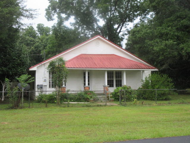So much potential in this 3 BR, 1 BA REO home on .62 acre lot! The home is located in Baker with only a short ride to everything Crestview has to offer, shopping, schools, restaurants and employment opportunities. The home features, hard wood flooring, knotty pine walls, a metal roof, great front porch, outbuildings,beautiful trees and so much room to grow!