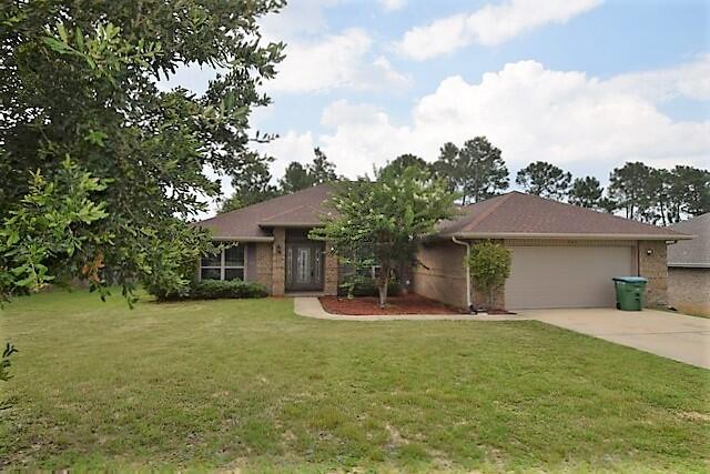 Back on the market,  no fault to seller. Motivated seller, bring all offers!  What a lovely all brick home located south of I-10!   Open concept floor plan featuring a split bedroom design with 4 bedrooms and 3 full baths.  The office located just off of the entry to the left and dining room to the right.  Huge family room has plant ledge and open site view of kitchen, dining room and breakfast nook.  Large kitchen has granite countertops, gorgeous back splash, breakfast bar, stainless steel appliances and large pantry. Laundry room is located just off of the kitchen.  The master bedroom suite has trey ceiling and French door to the lanai. The master bath suite has his and her walk-in closets, separate vanities, garden tub and separate shower.  Freshly painted interior.  Three bedrooms are divided by the kitchen with one bedroom and bath on the other side, great for guest. The other 2 bedrooms and bath on the other side, with this bath having access to the lanai, so come add your pool to the back yard as the septic is located in the front. Huge back yard with privacy fence and a large concrete pad for your boat, RV or workshop. Sprinkler system, gutters and security lighting. Seller will provide a $2000 carpet allowance with full price offer at closing. Buyer to verify all information they deem important.