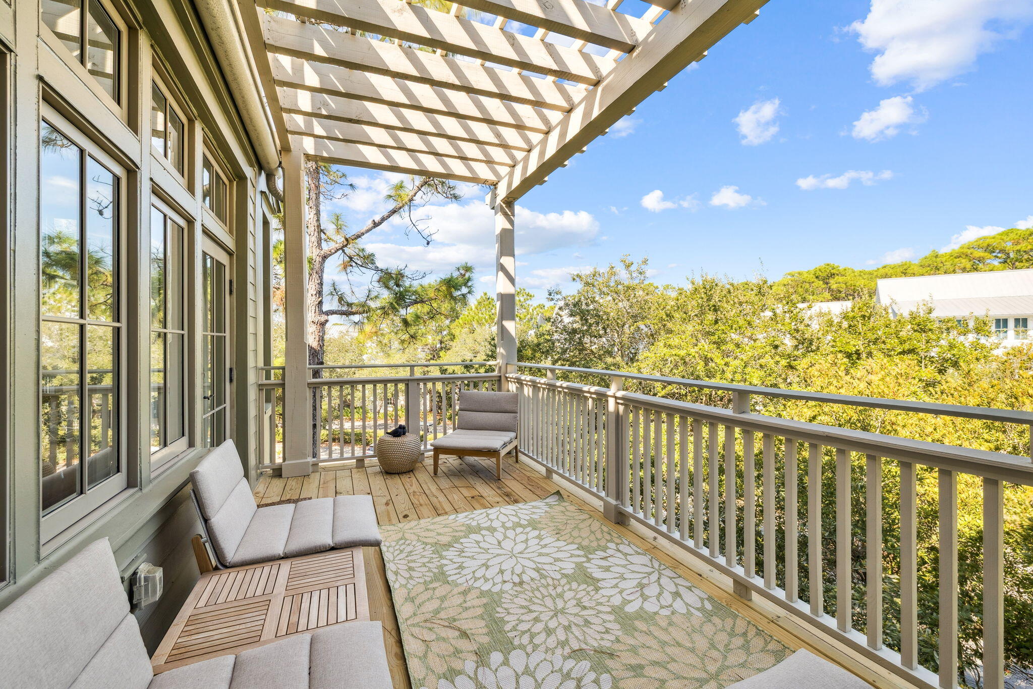 The only beachside one-bedroom, two-bath residence in Watercolor's sought-after Beach District. A rare find in the heart of 30A, this multi-level condominium spans the top two floors and offers exceptional privacy, two balconies, and sweeping treetop views, all just steps from the Beach Club, Gulf-front pools, dining, and boutique shops.
The first level opens to a bright, expansive living and dining space wrapped in floor-to-ceiling windows. Natural light floods the interiors, creating a welcoming environment that blends seamlessly with the outdoors. The living area provides flexible accommodations, easily transforming into additional sleeping space for guests, while the adjoining balcony invites morning coffee or evening relaxation in the coastal air. The dining space comfortably... ...seats six, anchored by a kitchen thoughtfully outfitted with Bosch, Café, and GE appliances, blending quality, efficiency, and design for effortless entertaining.
Ascending to the second floor, the primary suite becomes a retreat unto itself. Perched above the treetops, this private sanctuary features its own balcony with sweeping sunset views. the perfect vantage point to close the day with a cocktail in hand. With its elevated position and sense of seclusion, the suite captures the essence of refined coastal living.
Beyond the residence, owners enjoy access to Watercolor's exceptional amenities, including six resort-style pools, a private beach club with Gulf-front dining, tennis and pickleball courts, a state-of-the-art fitness center, and a vibrant town center filled with shops and restaurants. Parking is no problem, as 2 owner's parking permits for any-time parking in the convenient Green B lot are included with purchase! Scenic biking and walking trails wind throughout the community, connecting residents to Western Lake, lush green spaces, and the natural beauty that defines Watercolor.
Blending a prime location with privacy, design, and world-class amenities, this residence offers a rare opportunity to experience the best of coastal living along 30A.