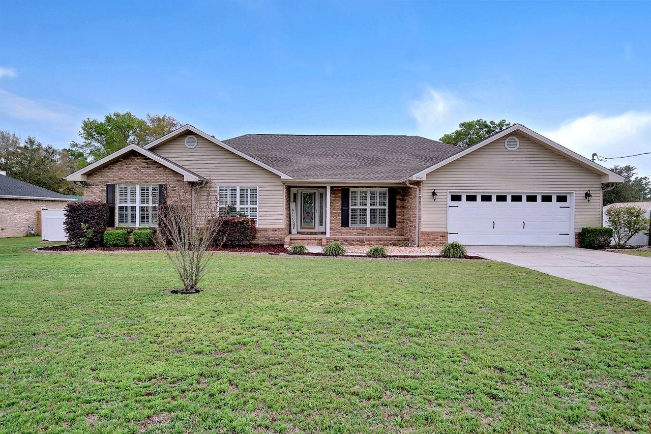 This is the unicorn everyone is chasing! 4 bedroom 2 bath POOL home on .60 acres! Meticulously cared for home boasts pride of ownership from the moment you pull in the driveway. Beautiful landscaping and covered front porch will greet you on your way in to this inviting home. Rich deep multi-toned wood floors accented by calming neutral paint colors throughout. The shiplap on the corner gas fireplace, open floor plan, and the raised ceiling in the living room provides a modern updated farmhouse feel. In the kitchen you will find ample cabinets and counter space that will impress the most discerning chef along with a giant island to gather around for meals or entertaining. The elegant granite is adorned by bright white cabinetry and newer stainless steel appliances. This former Parade of... Homes winner doesn't stop wowing you there. Formal dining room with plantation shutters is large enough to entertain a large dinner party. All the bedrooms are very large with one bedroom offering ultimate privacy for guests suite. The master retreat is a calming shade of grey with plantation shutters and ensuite bath featuring granite counters, large soaking tub, and a separate shower. But the outside of this home is where you will truly fall in love. The 1800 square feet enclosed lanai features an 18x36 inground saltwater pool. Enjoy grilling under the covered porch while guests gather around the pool all while in the security of the screened enclosure. All this and there is still a yard big enough (over a half acre) for any kind of activity your heart desires.  Technical aspects of this home include a new 50-yr dimensional shingle roof put on 5 years ago. Brand new water softener installed this year. HVAC is approx 8 years old. Pool liner in 2020. Septic pumped in Jan 2021. Renovated kitchen, baths, fireplace and lighting in 2020. This home has it all!