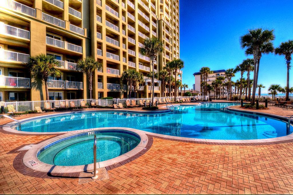 HERE'S YOUR CHANCE to own a vacation or investment condo at the GORGEOUS Grand Panama luxury resort! This beautiful 1 Bed/2 bath with bunks sits on the corner of Tower 2, so you have gulf views of the sunrise and sunset from the balcony. Amenities include 2 heated pools,2 hot tubs, Tiki bar, BBQ area, fitness center, large conference room, meeting room, business center, 24/7 security, covered parking garage and a covered walkover that brings you right to the beach! Close to shopping, restaurants, tourist attractions, skating rink, and fun centers! Unit is a rental money machine that is currently on a short term rental program that did 51k gross in 2022! Sellers are offering a paint allowance so you can pick your own colors!
