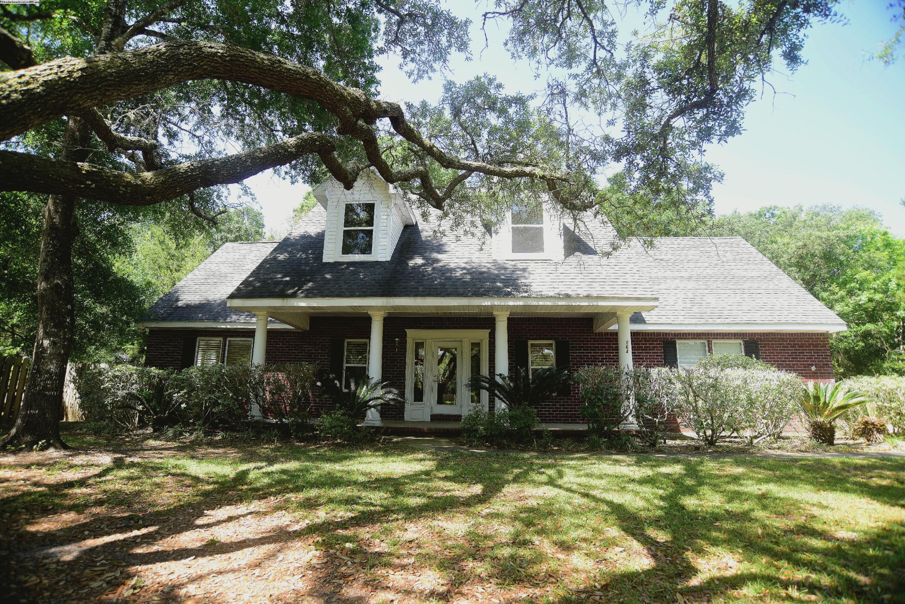 Great all Brick home on large lot in great location close to Bay and 25 minutes drive to Eglin AFB. Beautiful Landscape lot with lots of mature trees. This home offers a desirable open floor plan with Large Great Room with Fireplace & Large Kitchen area adjacent to Dining area. Hardwood Floors offers easy care in these areas. Off the Great room is Utility room with half bath. Master Bedroom downstairs with Master Bath, double vanity, whirlpool tub and separate shower. Upstairs are two good size bedrooms that share Full bath. Lots of additional storage in upstairs hallway. Bonus room upstairs would make great office or game room. Hallway doors open to Sun Deck overlooking back yard. NON SMOKING. PET LIMIT: 2 small-medium sized dogs with non-refundable pet fee. NO CATS. Any dog must be spayed/neutered, housebroken and current on all shots. Any person 18 years old or older must complete separate applications. Tenants required to carry renter's liability insurance while occupying the home.