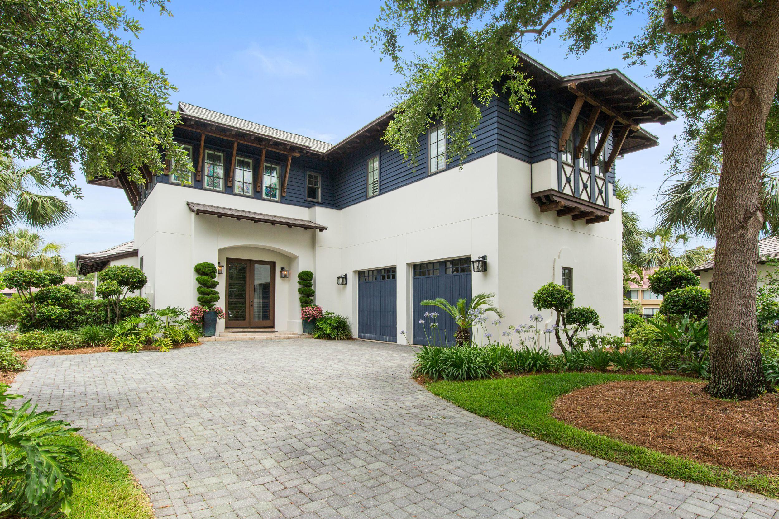 Back on market, no fault of seller. Located in the lovely Island Estates community, this four bedroom, four bath home is offered furnished with high end Maitland-Smith furnishings.  The waterfront home overlooks the lake and is just minutes from the gulf.  The large, open kitchen includes a sub-zero refrigerator, Wolfe stove, and Bosch dishwasher.  The downstairs features a separate breakfast room and dining room as well as the open living room.  The master bedroom is downstairs with an additional office that could also be a bedroom. 

The upstairs includes two bedrooms with full baths and a balcony overlooking the beautiful lake fountains. 

The outside porch offers a beautiful veranda leading to private pool. 

The home has a new roof, updated HVAC and water heaters.