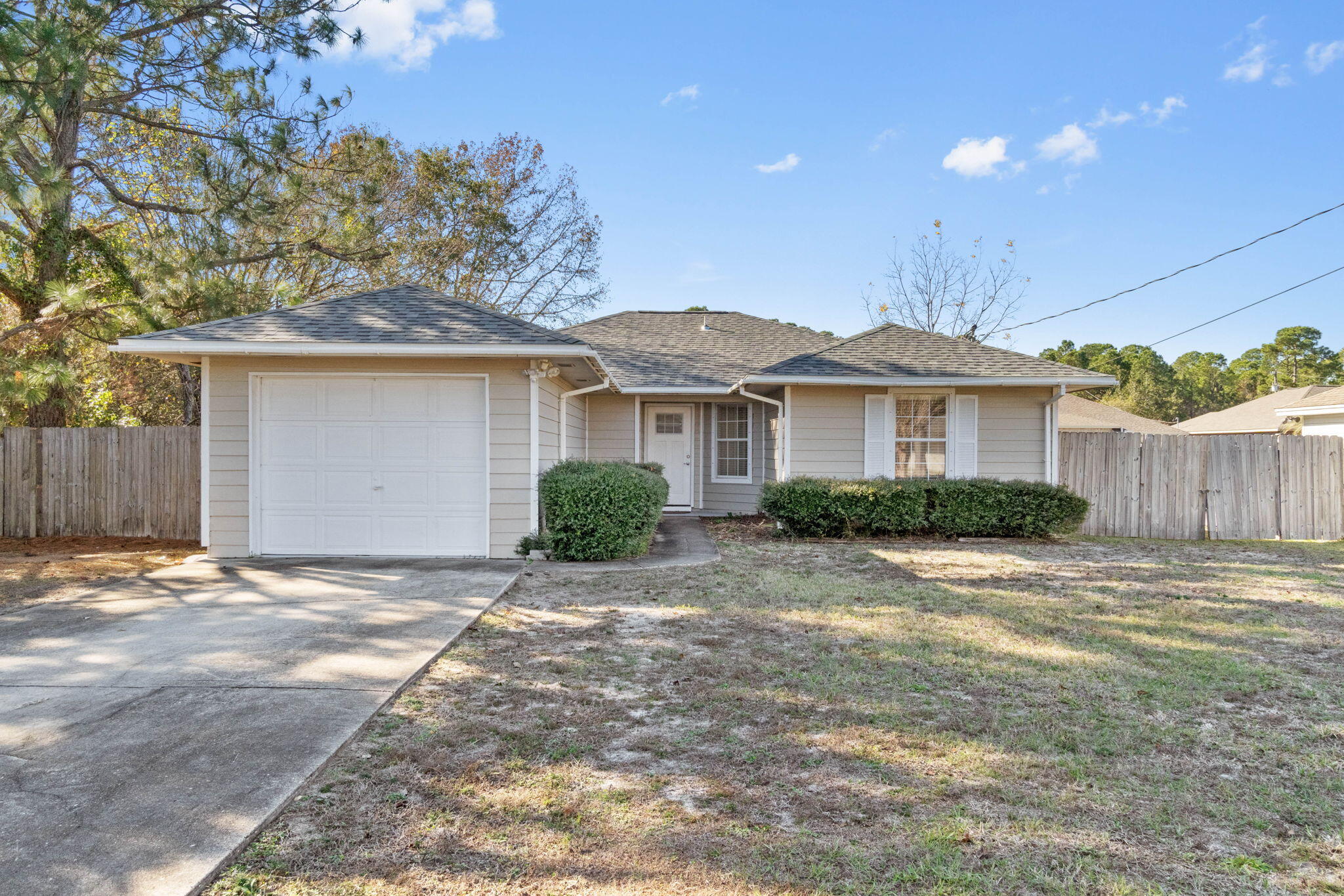 Totally remodeled and just minutes to the front gate of Hurlburt Field and only a 30 minute drive to Eglin AFB. This gem is a perfect primary residence, second home, or investment property! Have peace of mind with a roof just replaced November 2022, new HVAC in 2019, and a water heater replaced December 2018. Pull up to this adorable west Mary Esther home and walk inside to find a beautifully updated home. Wood look tile floors greet you and extend through all the common areas and a vaulted ceiling in the spacious living room adds to the fantastic open floor plan. You'll love this kitchen with granite countertops and room for bar stools and a breakfast nook, soft close white shaker style cabinets, separate pantry, and stainless steel appliances including a low profile microwave and a smart camera french door refrigerator! The master bedroom is a nice size with a private bathroom and updated extended vanity with Corian counters. The other two nice sized bedrooms are on the other side of the house and share another nicely updated bathroom. The spacious backyard has a large concrete pad within the fully fenced in backyard. There's a double gate on one side with plenty of room to pull vehicles and/or a boat into the backyard, and there's no HOA or restrictions to worry about! Also, enjoy the use of a large backyard storage building. Welcome home!