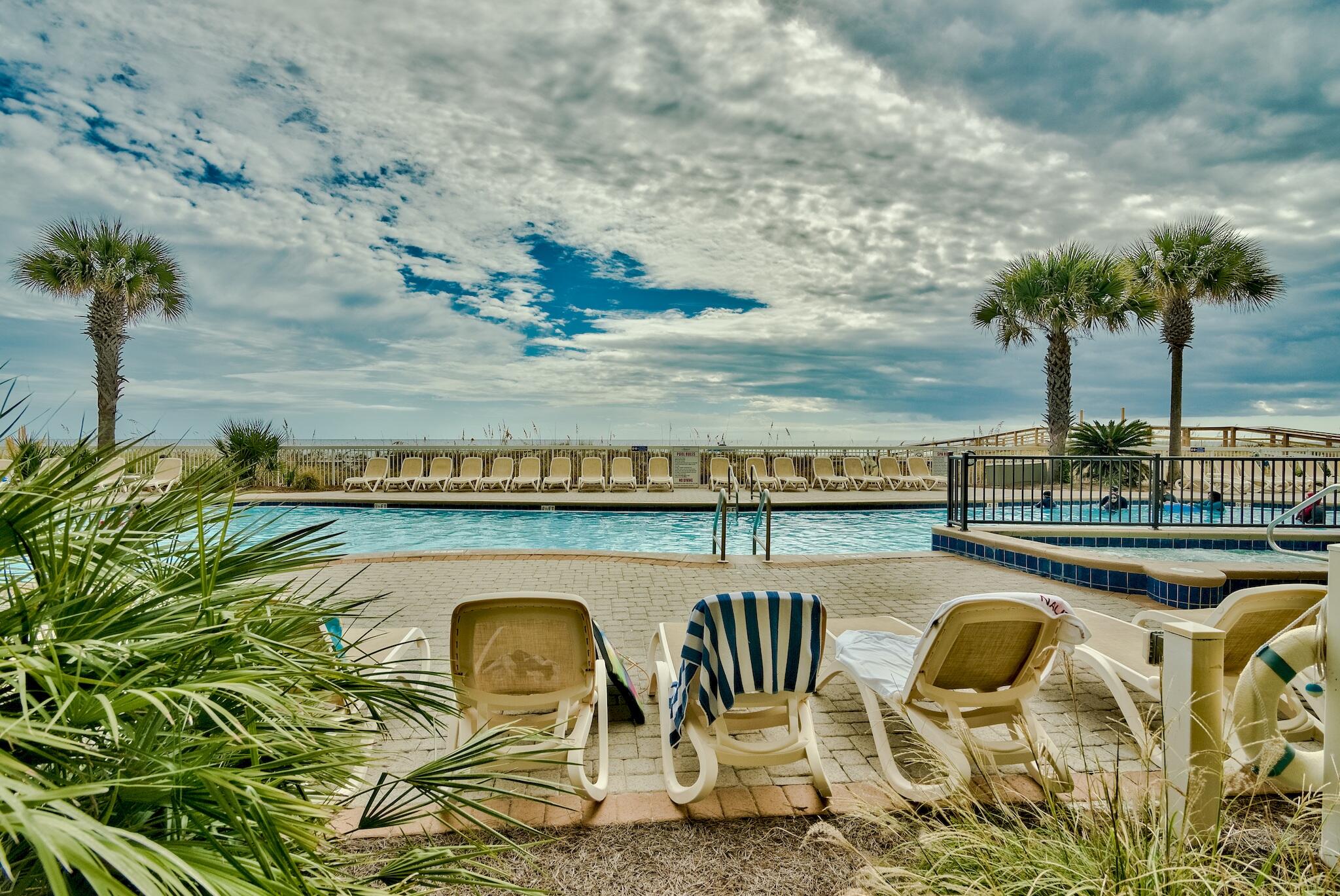 Gulf Front living at its finest in this 3-bedroom, 3-bath  Coastal mediterranean condo. Azure is one of the premiere gulf front condos on Okaloosa Island. This well appointed condo includes an open layout iwth kitchen, dinging and living all open to one another and enjoying full view of the Gulf. The kitchen features granite counters, stainless steel appliances, and wood cabinets. Just off the living areas , is a generous sized balcony to enjoy sit and take in all the views. The Master Suite is Gulf front and too enjoys the views of the Gulf and access to the balcony. The ensuite has a spa-like bath with soaking tub, separate shower and his/her closets. There are two guest bedrooms that each have their own bath. Interior photos have been scheduled and will be uploaded the week of the 21st. Imagine one of the area's most luxurious condominium complexes with every amenity desired including 2 pools, 2 hot tubs, a spray park, fitness center and a large boardwalk to access the beautiful beach. This is a turn-key property - all you need is your bathing suit!