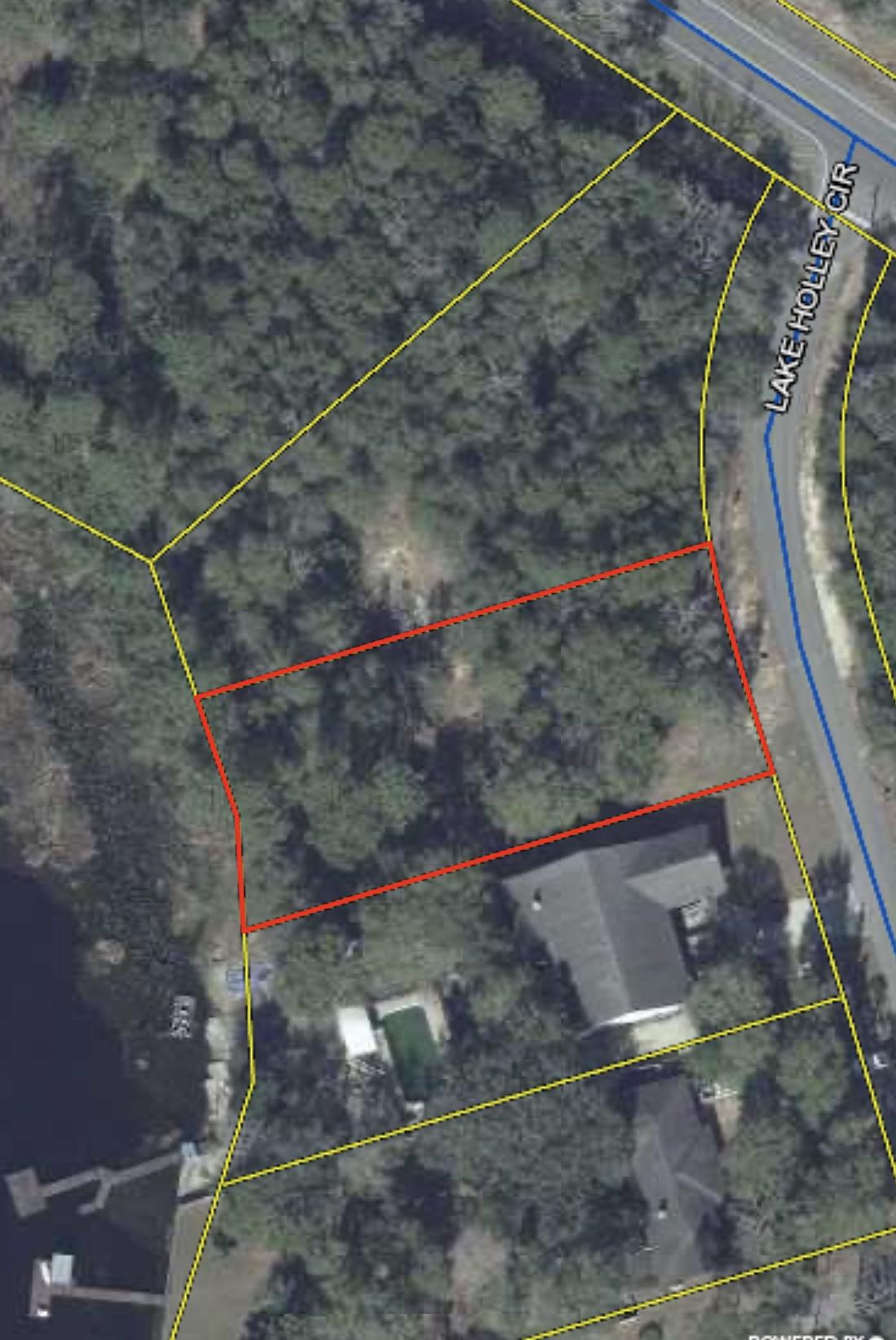 Don't miss out on the opportunity to own over a 100 feet of waterfront property at the end of the beautiful Lake Holley, located in one of Walton County's more desirable lakefront communities. The lot is partially cleared, lightly wooded, and is the perfect place to build your dream home. Lot is approximately .56 of an acre leaving endless floorplan possibilities. Your lakefront sunsets await you. Call your agent and favorite builder today before it's too late. Lot requires well and septic, not currently in place.