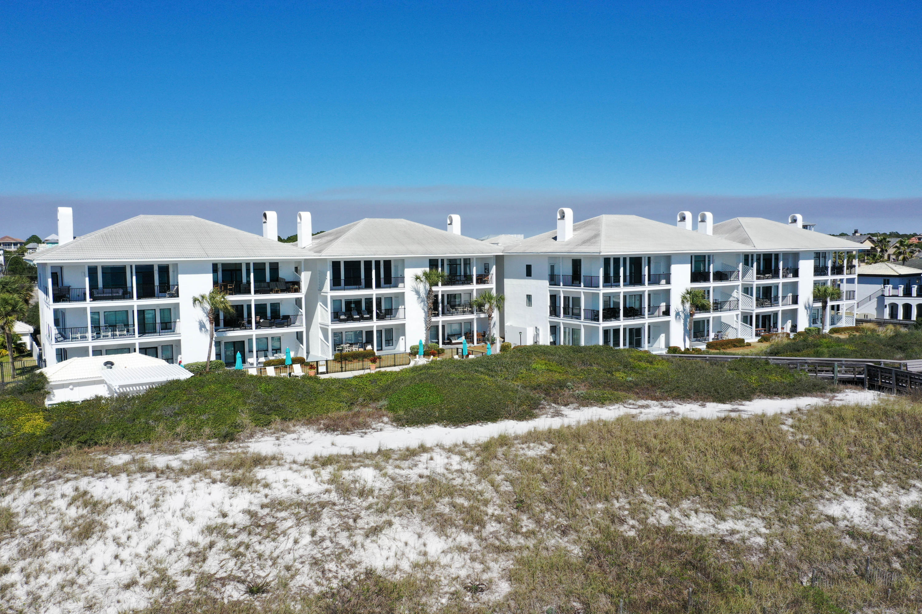 Enjoy stunning sunsets over the Gulf of Mexico from this well maintained unit at The Pams of Dune Allen on 30A. This condo has three spacious bedrooms each with it's own en suite full bathroom. The kitchen has a large island with bar seating that overlooks both the dining and living rooms. Updates include all new appliances, new paint throughout and new furnishings and decor. The master bath features a large double vanity as well as a spacious shower. The Palms of Dune Allen is a gated gulf front condominium located on the west end of Scenic Highway 30A. Just a short drive to shopping, restaurants and entertainment located in Gulf Place. Grand Boulevard at Sandestin with fine dining and shopping. And the charming beach communities of Grayton Beach, Watercolor and Seaside.