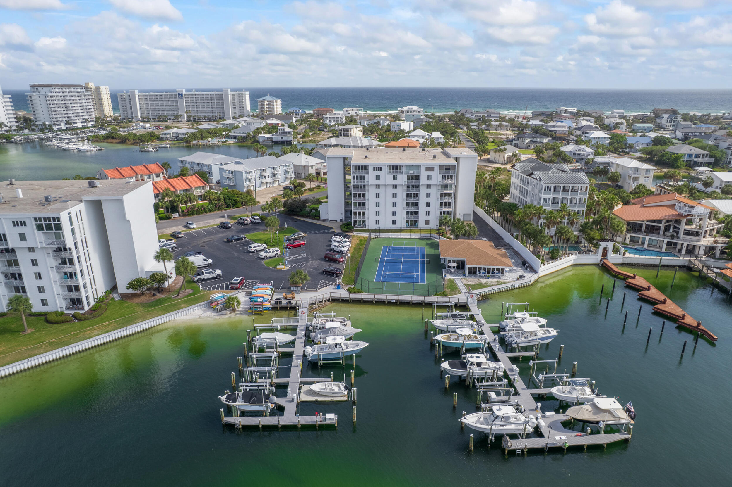 Beautifully maintained 2-bedroom, 2-bath waterfront condo located on Holiday Isle in Destin. This immaculate 5th-floor residence offers stunning Gulf & harbor views, creating the perfect coastal backdrop. It features floor-to-ceiling side windows in the living area, flooding the space with natural light & offers those expansive, breathtaking views from the private balcony. The interior has been newly painted & features tile flooring throughout with no carpet, providing a clean, cohesive look & easy maintenance. Thoughtfully cared for, this condo delivers comfortable coastal living in one of Destin's most desirable waterfront locations for the investor or PT/FT owner. Dolphin Point offers an impressive array of amenities, including heated pool, clubhouse, pickleball & tennis courts, gated beach access, paddleboard/kayak launch, BBQ grills, golf cart parking & MORE!. Whether you're unwinding on the beach, taking in the harbor views or enjoying the many on-site activities, this condo delivers a true taste of paradise!