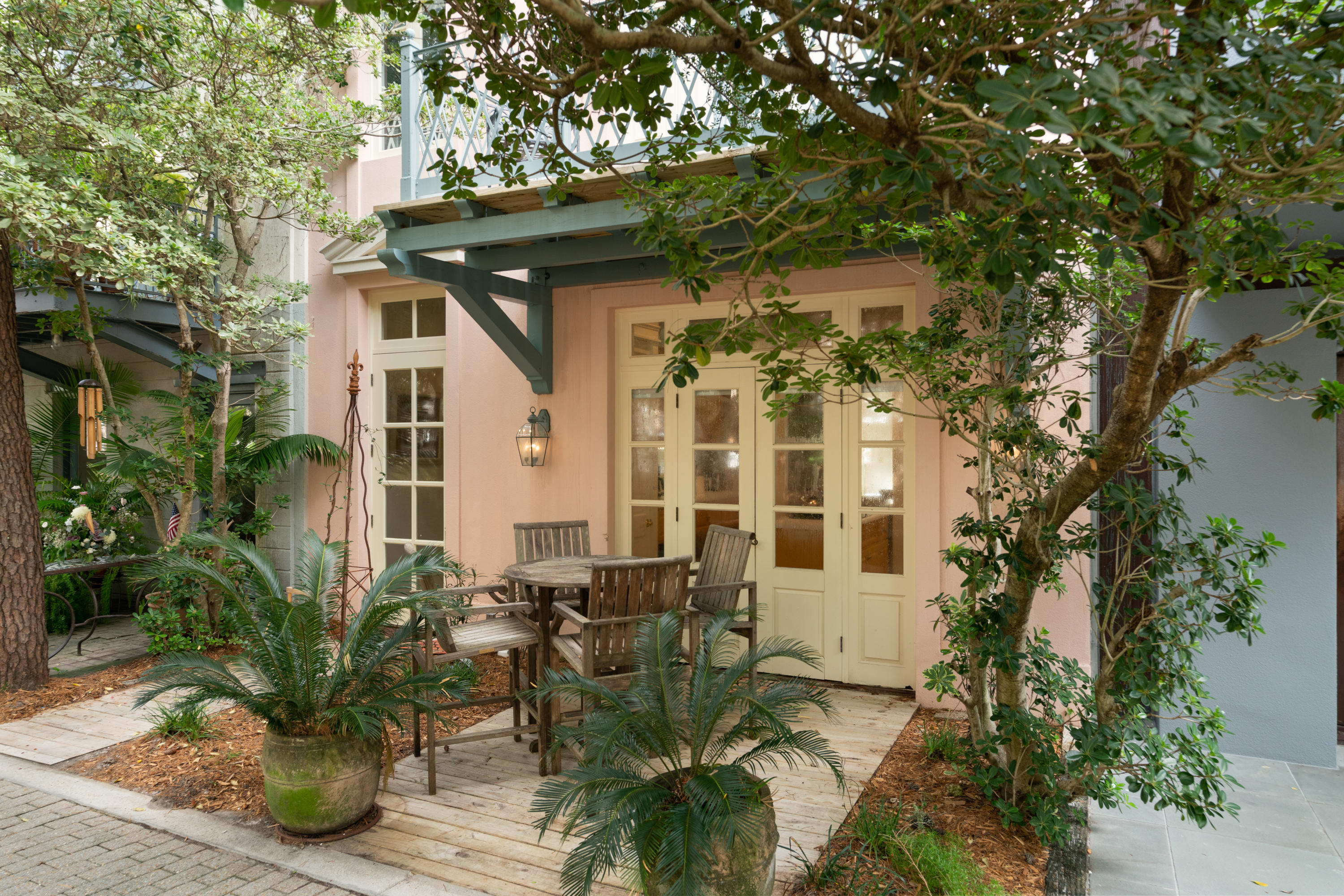 With the graceful design of a European row house, the 'Chatelet' reveals a sense of casual elegance, at home within fashionable Ruskin Park. This celebrated location makes it easy to visit Seaside's charming boutiques and imaginative art galleries by day, and then open up the French doors to your own personal outdoor seating area, perfect for enjoying a lovely meal or a fine glass of wine.

Natural light flows throughout the newly remodeled 'Chatelet', as a series of French doors and windows open up to the beauty of Ruskin Park. High ceilings only add to the appeal of the main living room, a comfortable and well-appointed space that flows into a separate dining room for six and a fully equipped kitchen, completed by a center island and new, stainless steel appliances. The spacious interior of the cottage makes way for an outstanding three levels and a total of four bedrooms and five-baths, plenty of room for a large family or a group of friends. Leading up to the second level of the cottage, the king-sized master bedroom comes into view, complemented by its own private master bath with a shower, and opening up with more French doors to a private balcony.

Another second-floor bedroom is ideal for kids, outfitted with dual bunk beds and another private bath with a tub, located just across the hall. A washer and dryer, tucked inside a laundry closet, and abundant hardwoods finish off this level.

Finally, the third level of 'Chatelet' comes into view with the outstanding addition of another king-sized bedroom overflowing with natural light. A queen-sized guest room also adds to this level, along with two private baths. Fit for a king or a queen, the 'Chatelet' provides an exceptional setting with plenty of extras in the heart of it all.
