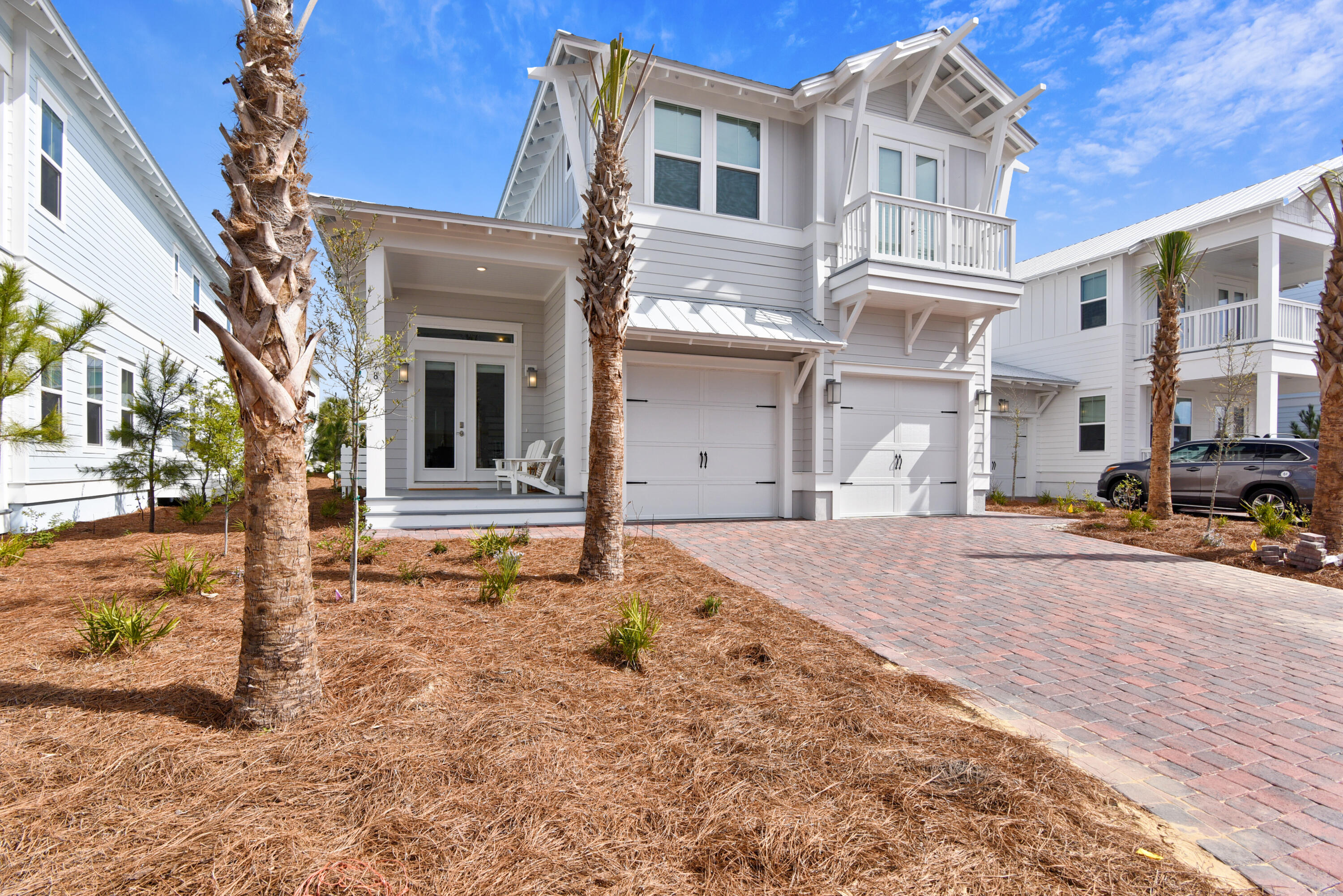 EASY TO SHOW! This gorgeous, professionally decorated, immaculate home is turn key ready and has everything you've dreamed of in a beach house! This home comes fully furnished and has the features you demand! Hardwood flooring throughout and tile flooring in the wet areas, 8' doors, smooth finish ceilings and walls, ceilings fans, and surface mount LED lighting. The chef inspired kitchen has maple door cabinetry with soft close doors and under cabinet lighting, built in gas cooktop, single wall convection oven and dishwasher with hidden controls. The countertops are granite with backsplash and stainless double sink, brushed nickel pot filler, Moen faucets and wood shelving throughout. The luxurious bathrooms feature granite throughout and brushed nickel Moen faucets.  The Master bath has a frameless glass enclosure with rain shower head on two separate valves and his and hers separate sinks. Smart Home Technology is included with touch panels to allow you to set your AC, control lighting and even secure your home. Exterior features of this home include, oversized covered porches with ceiling fans, professional landscaping, auto garage door openers and an outdoor shower.
