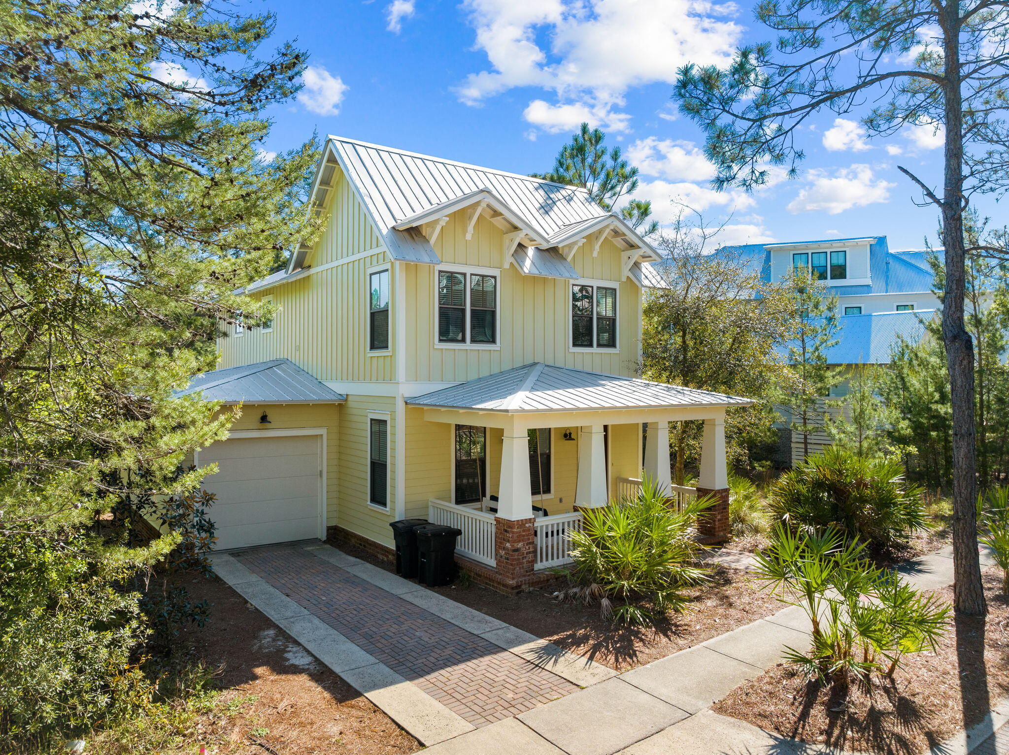 BRING AN OFFER!  GORGEOUS LAKE VIEWS, FULLY FURNISHED WITH 6-SEATER GOLF CART INCLUDED WITH SALE - Nestled within the private, gated community of Forest Lakes located on 30A, this stunning home offers an exceptional blend of comfort, style, and natural beauty. With access to scenic walking trails, lush green space, a large community pool, and a covered outdoor pavilion, this residence provides the perfect balance of relaxation and recreation.

At 24 Lanier Drive, step inside the entry foyer where your eyes immediately are drawn to the large back windows and French doors leading to the back porch overlooking the lake. But first, turning to the left you are greeted by the first-floor primary suite with a beautiful master bath featuring a floor-to-ceiling tiled shower and walk-in closet. Headed back into the invitingly open main living area, you'll find those large windows framing serene lake views and filling the space with natural light. The peaceful setting continues onto the back, screened-in patio where you can unwind while taking in the tranquil lake views. Back inside, you'll notice the beautifully designed kitchen which features stainless steel appliances, granite countertops, and a spacious island with a breakfast bar, making it ideal for both casual meals and entertaining. 

Upstairs, a spacious landing currently serves as an additional living space, perfect for a media room or cozy lounge. The second level also features a dedicated laundry room, a charming bunk room, and a guest bedroom with a shared full bath.

The crown jewel of the upper level is the luxurious primary master suite, boasting breathtaking lake views, a generous walk-in closet with custom built-ins, and master bath complete with a double vanity and a floor-to-ceiling tiled walk-in shower with a built-in bench.

Whether enjoying peaceful mornings by the water, exploring the community's outdoor amenities, or gathering with friends and family in the beautifully designed living spaces, this lakefront home is a true sanctuary offering both elegance and comfort.  The home is being sold fully furnished and includes a 6-seater golf cart.

Being located on 30A, you have easy access either by golf cart, bike, or walking, to nature trails, the beach, dining, shopping, and entertainment. Forest Lakes is only a short distance to places like Gulf Place, Shunk Gulley, Growler Garage, and so much more.