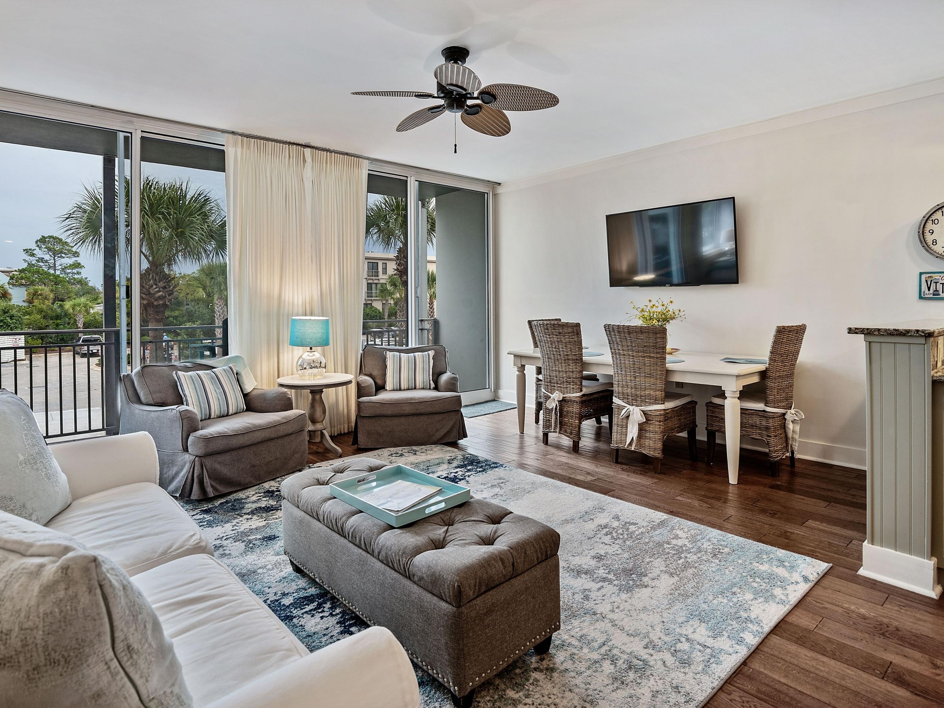 Life at the beach is fully enjoyed from this conveniently located condo in Gulf Place on Scenic Highway 30A.  The floor to ceiling sliding glass doors in the living area allows for natural light to fill the unit. Light colors and high ceilings accentuate the spaciousness of its floor plan as does the hardwood flooring that carries throughout the main living areas and bedrooms. The stylish kitchen features modern raised panel cabinets, granite countertops, and stainless steel appliances including a coveted gas range. The master bedroom features an ensuite bathroom with a walk-in shower.  The floor plan also includes a guest bedroom and bathroom as well as a full-size washer and dryer for added convenience. Enjoy gulf breezes from a spacious balcony, or take advantage of the Gulf Place amenities, including three swimming pools, two tennis courts, and dedicated beach access just a short distance away.