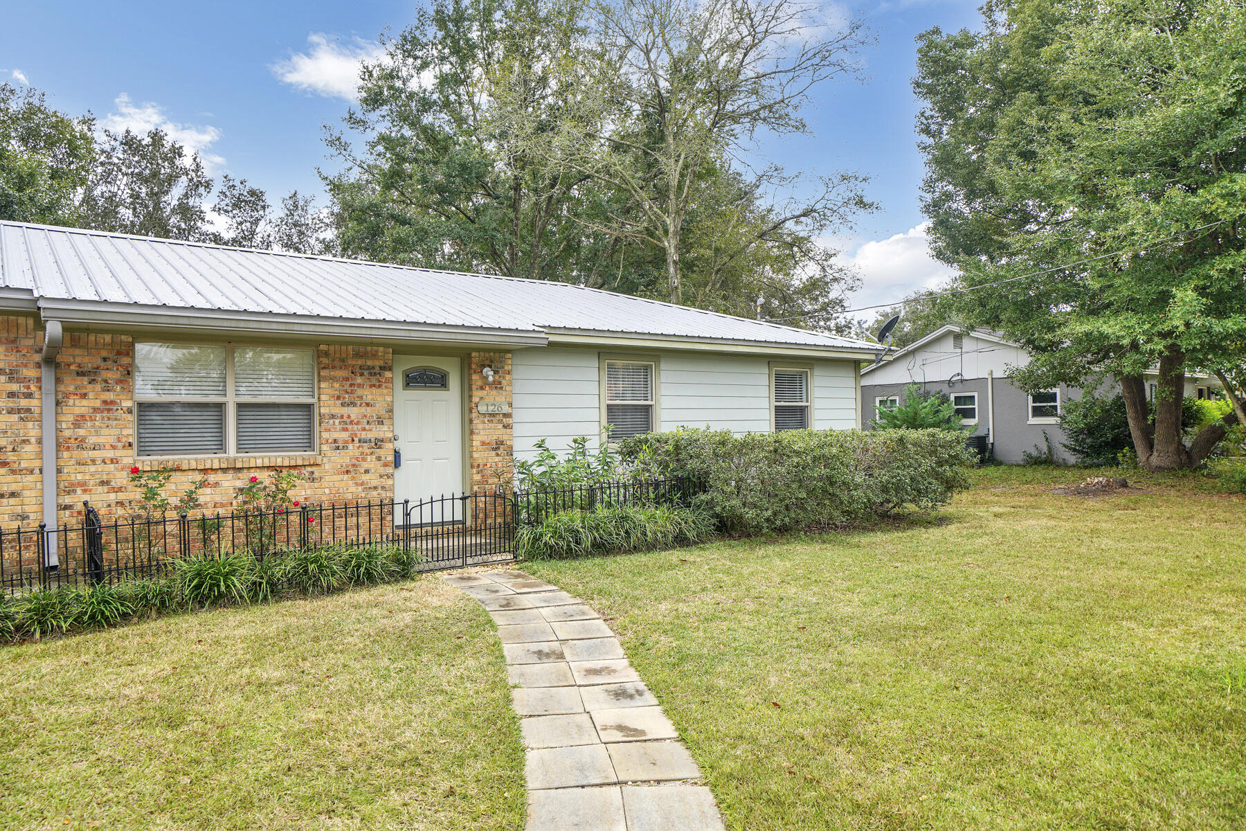 Three bedroom-Two bath home located centrally in Fort Walton Beach.  Sprinklers and lawn pump make lawn maintenance a breeze.   Metal roof was installed approximately 7 years ago, HVAC is 5 years old and water heater is approximately  8-9 years old.  Gas is available although all appliances are currently electric.   Relax on partly covered 21'x14' deck in the back yard with abundant ferns and Mexican petunia.  A side gate allows access to back yard to store a boat on a trailer or jet skis.  Home features an attached garage. Convenient to shopping, restaurants, Eglin Air Force Base, Hurlburt Air Force base and the beautiful white sandy beaches and emerald green water of the Gulf of Mexico.
