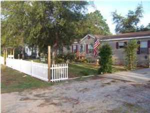 WOW owner is ready to sell .'5' Bedrooms!!!!  Very nice spacious home great location on a dead end street , located in Santa Rosa Beach. Close to shopping -hospital-dinning-beaches and school. Home has a large living area open dinning area, lots of room in the large kitchen  room for family gathering also eat in area. laundry room is off the kitchen, five nice size bedrooms two baths master bath has a separate shower and garden tub. Home has two outside building for storage ,large fenced  back yard, lots privately, Ideal for family fun. Great  cover carport. This home home ideal for the first time home owner ,second home, investment property or retirement home .