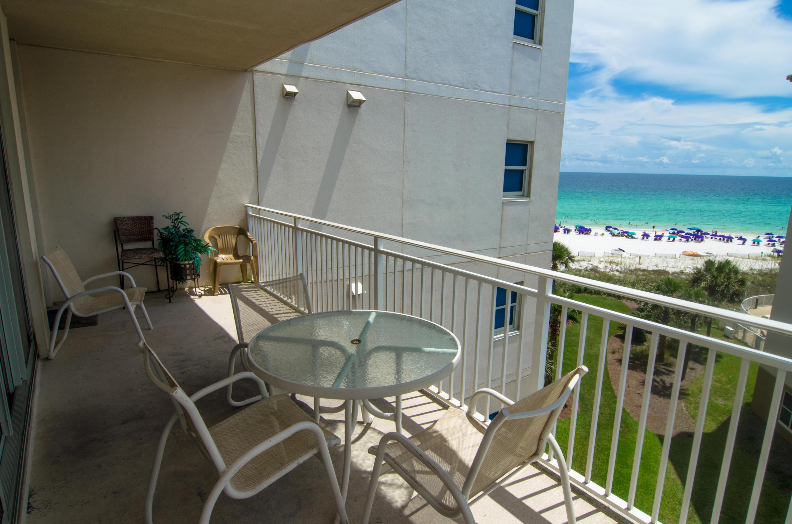 AMAZING opportunity to own a unique condo at Waterscape where there are only a handful just like it with views of the Gulf of Mexico! Enjoy an END unit with privacy all around that is located only 4 stacks back from the beach inside a coveted indoor hall. New beautiful hardwood floors and fresh paint are throughout this gorgeous 2 bedroom, 2.5 bath, condo with BUNKS!The gourmet kitchen has beautiful cabinetry, stainless steel appliances and granite counters. Enjoy one of the area's most luxurious condominium complexes with every amenity desired including 490 feet of pristine beach front. The remarkable courtyard features 3 pools, 2 hot tubs, waterfall and and a famed Lazy River that you have to see to believe! There is also a Children's play are with splash pad and water activites, game ro om, bbq grills, conference facility, fitness center and covered garage parking.