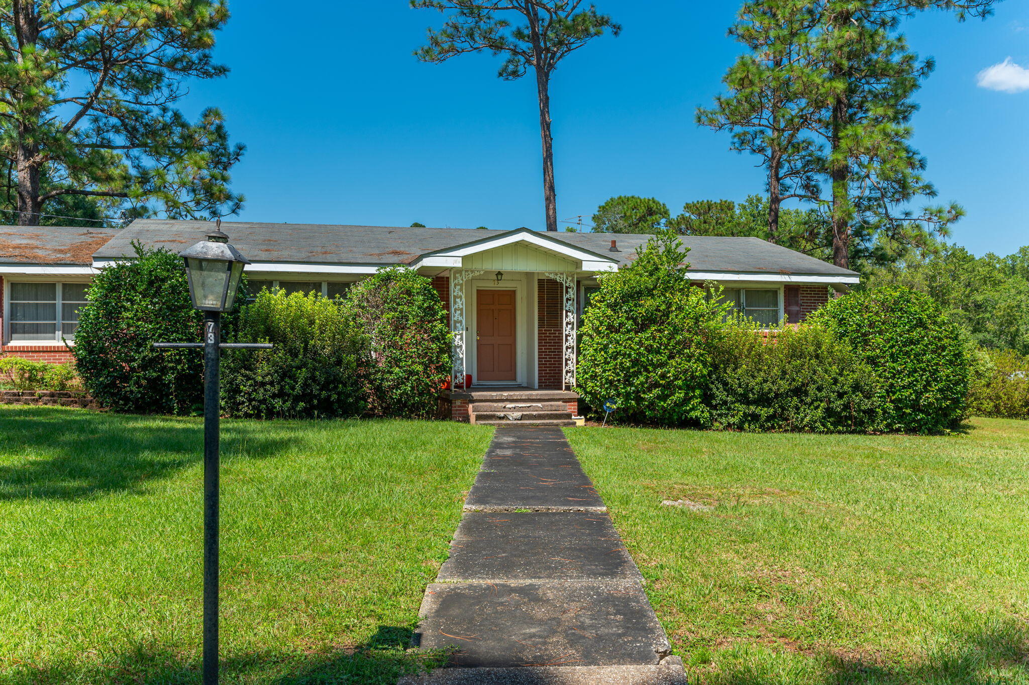 This beautiful one-story brick home is the epitome of comfort and style of years gone by. The spacious living room is designed for quality time with loved ones, while the three bedrooms and two bathrooms offer privacy and convenience. Outside, you'll love the generous corner lot, providing endless opportunities for outdoor fun, gardening, or simply enjoying the Florida sunshine. With its excellent location in DeFuniak Springs, you'll have easy access to schools, shops, dining, and more, making it an ideal choice for families and anyone seeking a welcoming community.  Do not let this opportunity pass you by! Requirements are a credit score of 600, household income of $4250 per month and one year consistently employed.