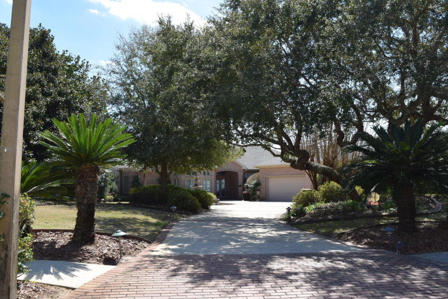 Come see your 180degree view of the Sound both East and West, where you can enjoy both spectacular sunrises and magnificent sunsets. This waterfront estate has almost one acre and 127-feet of Santa Rosa Sound frontage. This magnificent, custom-designed 3BD/3BA home combines the best of everything. The moment you enter the circular courtyard driveway you know you are someplace special.This home is loaded with charm and comfort and has a sweeping panoramic view of Santa Rosa Island and Sound from the family room, kitchen, sun-leisure room and master suite. In a wonderful Florida design, all of the main living areas open to the pool and have views of the water.
This split design home with approximately 3800 sq. ft. of pure luxury has soaring 12-ft ceilings, oak hardwood and ceramic tile floors, 11-ft Pella windows/doors and 8-ft solid interior doors with porcelain and stainless door hardware, plantation shutters throughout, granite wet bar with glass-front solid cherry cabinets and wine chiller. High architectural arches, custom-milled columns and trim, knockdown wall finish with bull-nose corners and crown molding add charm to every room.
The 30-ft x 20-ft great room features a built-in with custom bookcases and double sided gas fireplace .The office/ fourth bedroom  provides a quiet working environment with spacious bay window that looks out a professionally maintained front yard and fountain and glass doors to look out towards the sound in the other direction. This room is versatile and can be used as a nursery or guest room. 
The dream kitchen with 12-ft x 8-ft sliding glass doors to the lanai and off the sun-leisure room has top-of-the-line appliances (gas cook top, radiant and convection double-ovens, built-in refrigerator, raised-dishwasher, solid cherry cabinets and granite countertops.
The home also has a backup generator system, whole-house electrical surge system, "smart" wiring in every room, security system, whole-house water conditioning, high-efficiency heating/cooling and Rinnai endless water heater, central vacuum, filtered drinking water system, oversized 3-car garage with built-in cabinets and mezzanine storage and a separate heated/air conditioned storage room
Outside you will find a magnificent 43-ft x 12-ft lanai, Gunite pool and spa set on an enclosed 23-ft x 52-ft pool deck with separate pool bath and outside shower. Down at the water there is a private, white-sand beach with the seawall set back 30-ft from the property line, lighted boat dock, boathouse with 32-ft x 15-ft slip, 12,000 lb. boat lift and 1,000 lb. jet-ski lift. There is an abundance of wildlife just in and around the dock â€” dolphins, blue herons, osprey and terns and purple martins that keep the mosquitoes away!  It is a great place to fish  or just to relax and enjoy the sunrise/sunset from outdoors.
Maintaining the gorgeous professional landscaping is taken care of for you, there is spectacular exterior lighting and a lawn sprinkler system with water well. Pool service is also included. Need additional space to park an RV or take your boat off the dock? There is already a secluded are just for this! Take a short stroll through this serene neighborhood and along the boardwalk nature trail to the private community beach. Here you will find the "Ski Shack" with a picnic area, fire pit and grill for your convenience.
If you appreciate the very best, you must see this home that has been built with attention to every detail you can imagine. Paradise awaits you in this immaculately maintained home ready for occupancy this June!