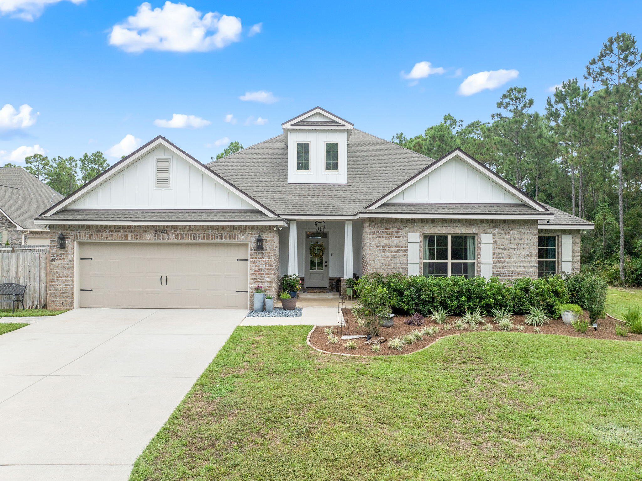 5-Bedroom Craftsman Pool home PLUS Bonus room and office with private Creek access in Gulf Breeze! Zoned for Soundside High School, this immaculate 5-bedroom, 3.5-bathroom, two-story is packed with luxury upgrades. Tucked away on a private, wooded lot with planted fruit tree's, this home offers both modern conveniences and peaceful seclusion.13' x 30' gunite pool with fire rock coping, a spacious pavered patio, and a fully fenced yard--perfect for both relaxing and entertaining. Surrounded by conservation parcels this Gulf Breeze gem is move-in ready and perfect for quiet living. This lot is located in Flood Zone X. Owner/ Agent. PLEASE NOTE- You CANNOT build in the back yard. This is a wetland buffer and protected wetlands with a creek running through the entire side of the yard.