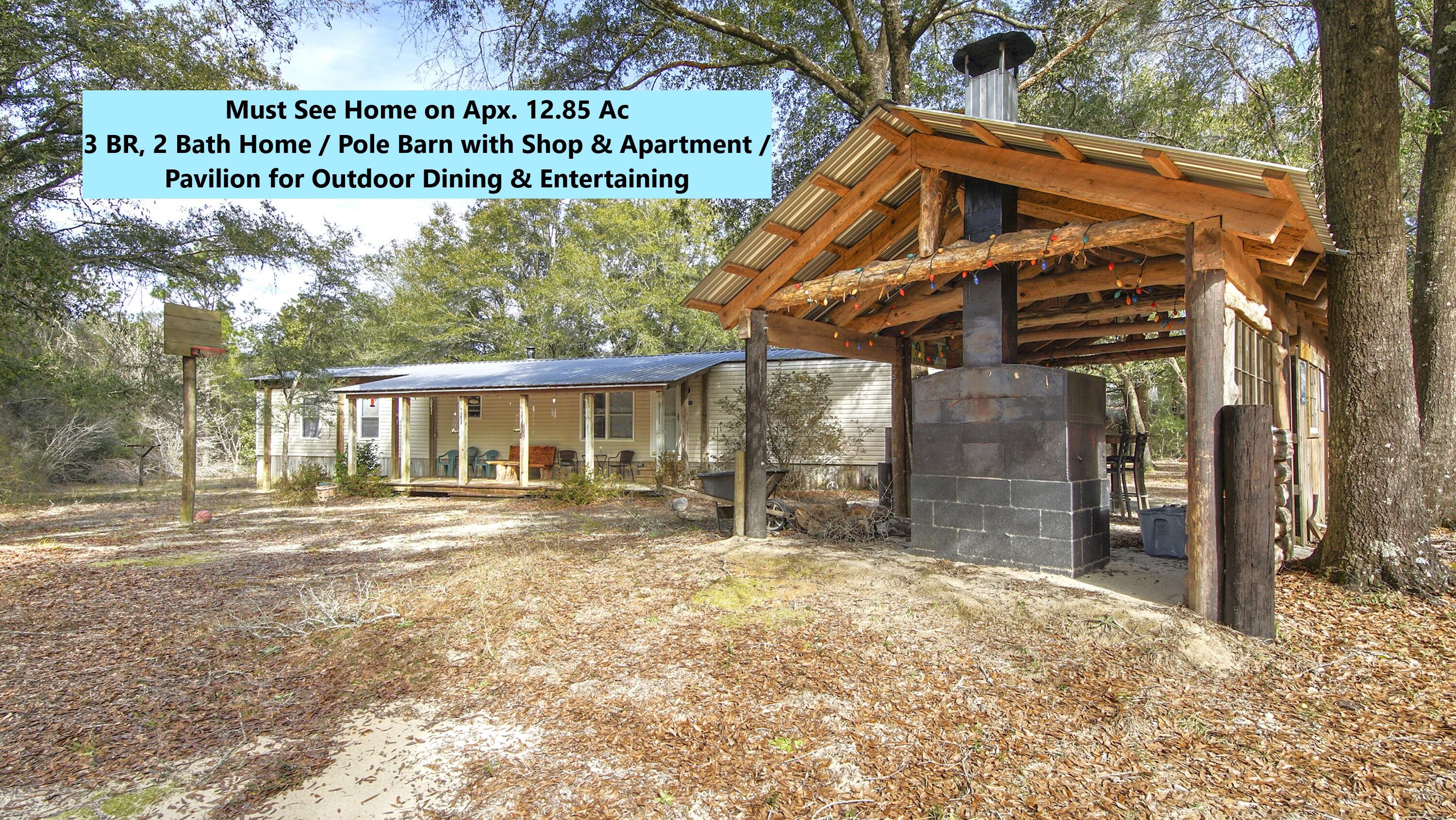 Beautiful 12.85+/- ac parcel w/ 3 BR, 2 bth home; 12x22 pavilion; 36x48 pole barn w/ enclosed shop & 1 BR, 1 bath apartment, complete w/ kitchen. This unique, well-maintained home & property is a one-of-a-kind...a definite must see! You'll love the tranquil & secluded location, but less than 5 mi drive to I-10 in Mossy Head for a quick commute to Defuniak Springs, Crestview, Niceville, FWB airport & Eglin Air Force Base. The hand-built pavilion is set up for entertaining w/ an outdoor wood-burning stove, mini fridge, table & bar. The 36x48 pole barn has an enclosed shop & full apartment! Trails throughout the property. Also a covered utility/wood shed & small tool shed. Mfd. home has a complete roof over, including front porch. A true gem!