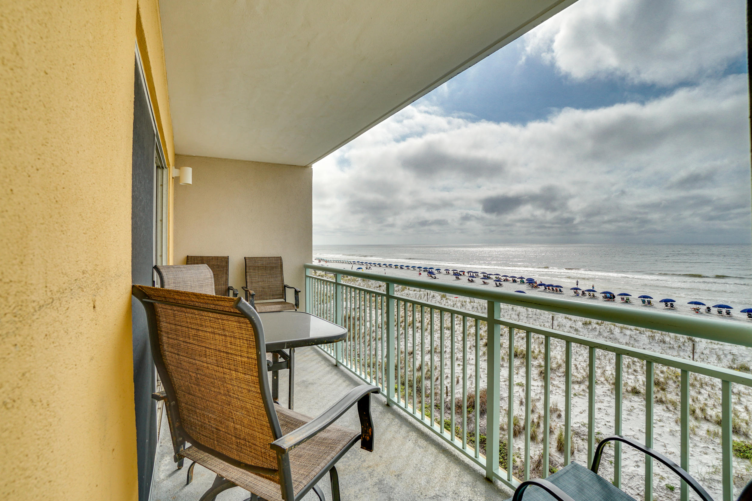 CURRENTLY UNDER CONTRACT, SELLER ACCEPTING BACKUP OFFERS
This gulf front corner unit with wrap around lanai allows for plenty of space for relaxation and entertainment.  Amazing gulf views from this 2BR/2BA, end unit at Pelican Isle. This condo is bright and beachy with additional windows, new laminate wood flooring in the living room, a relaxing large wrap-around balcony surrounds the dining and living room. The kitchen features tile floors, plenty of cabinet & counter top space, and a breakfast bar. The kitchen opens to the living space which has beautiful views and two access points to the wrap-around balcony. There are two nice sized bedrooms, one with a private bath and one with access to the hallway bath.  Other features include hallway bunks, washer/dryer, and a wonderful gulf front pool.  The corner unit is close to the stairs for easy beach access. Pelican Isle amenities include 300 feet of deeded beach, community pool, hot tub, & workout room.  **Buyer to verify all measurements**