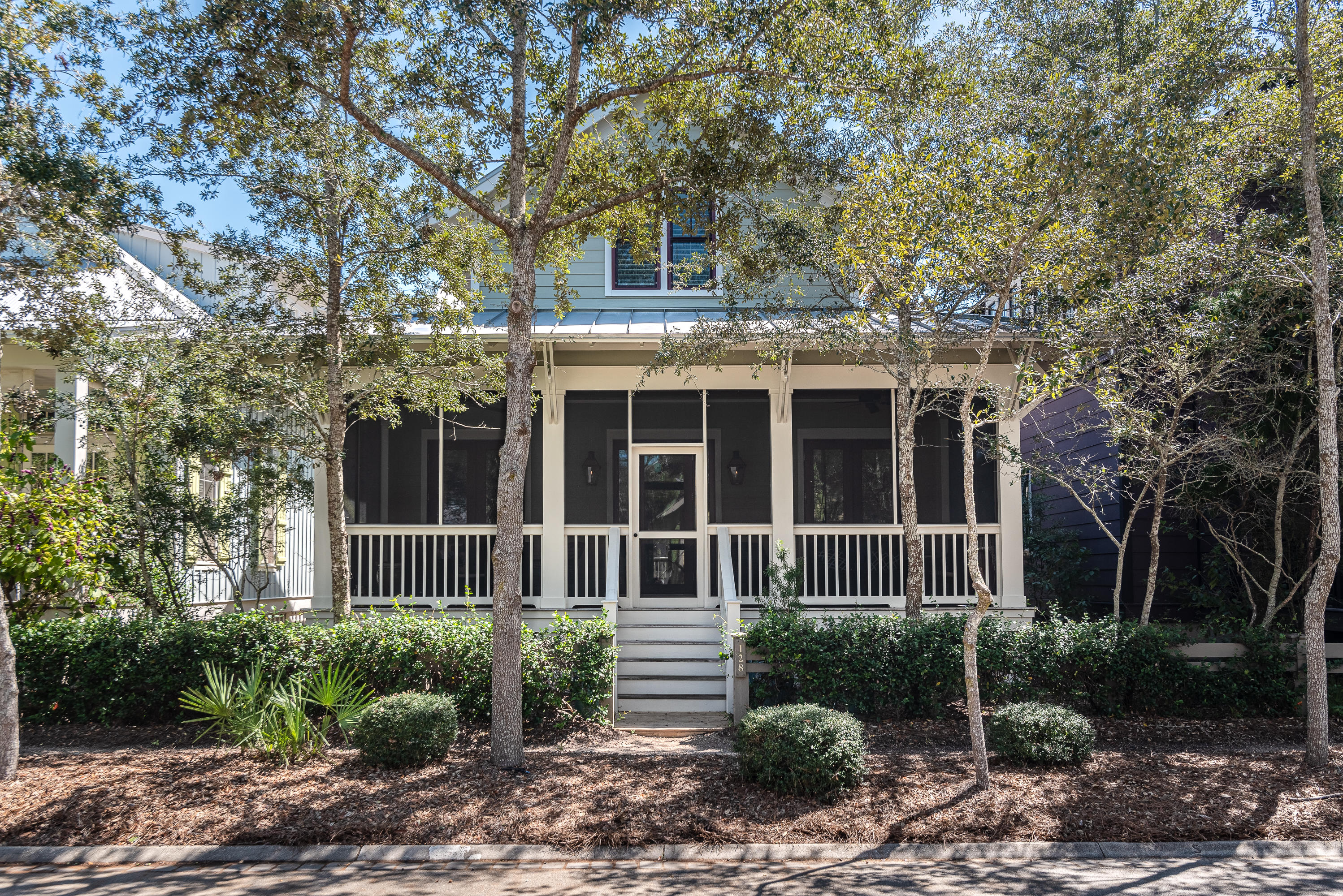Comfort and convenience in a beautiful Beach District cottage.  128 Mystic Cobalt is the perfect residence or investment property for someone who wants a low maintenance home close to the sand, and to all that Phase 1 of WaterColor has to offer.  Vaulted ceilings give the open floor plan additional light and a greater sense of space.  The home's 3 bedrooms each have their own en suite bath.    An attached garage affords covered parking and additional storage.  Front and rear screened porches are perfect for reading a book, outdoor dining, or for extending the main living space.  This is just the right house in an excellent location.